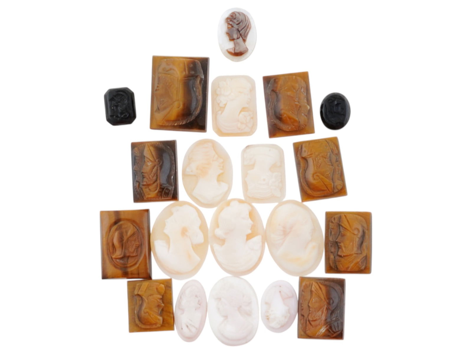 COLLECTION OF 20 VARIOUS ANTIQUE HAND CARVED CAMEOS: A collection of antique hand carved cameos, dating to the late 19th to early 20th century. Each piece features classical female portraits or knights in armor rendered in high relief. The cameos are pr