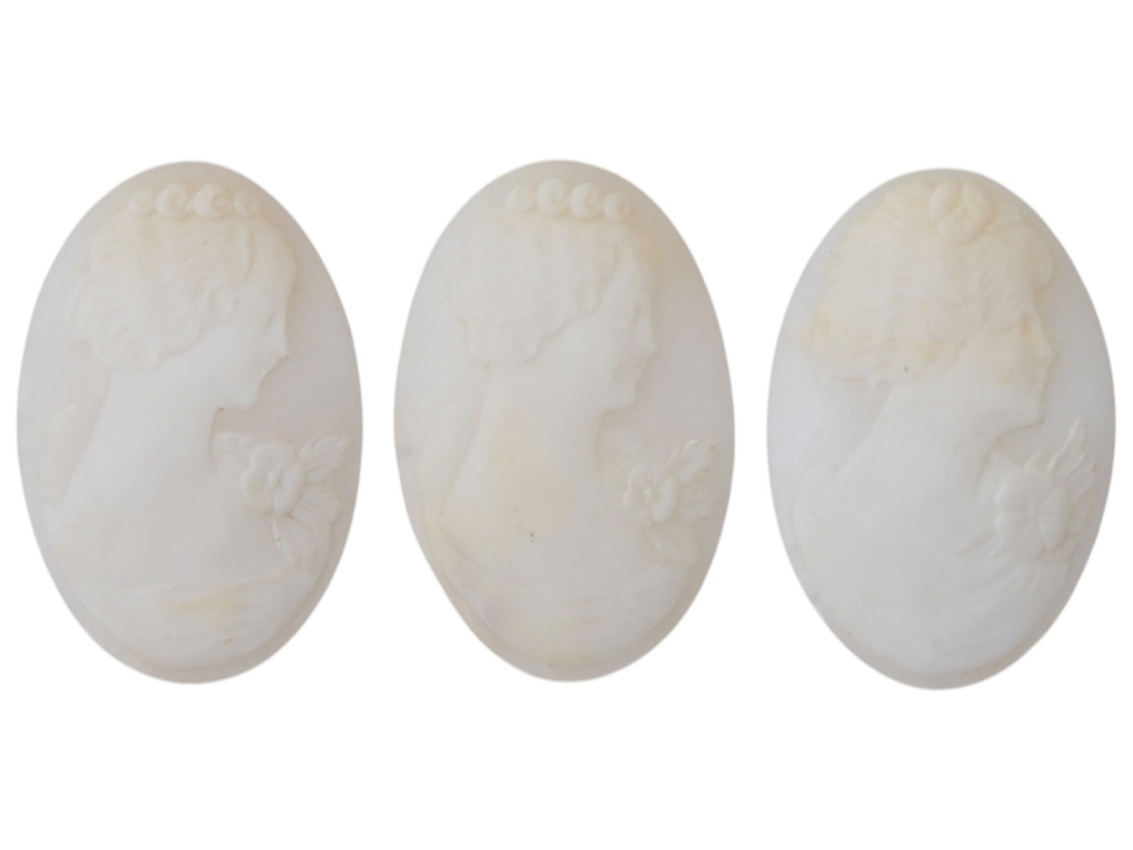COLLECTION OF PORTRAIT CARVED SHELL CAMEO MEDALLIONS: A collection of three vintage cameo medallions. Each oval cut shell cameo depicts a relief female portrait in profile in the Victorian manner. Vintage Jewelry And Accessories, Intaglios And Cameos, an