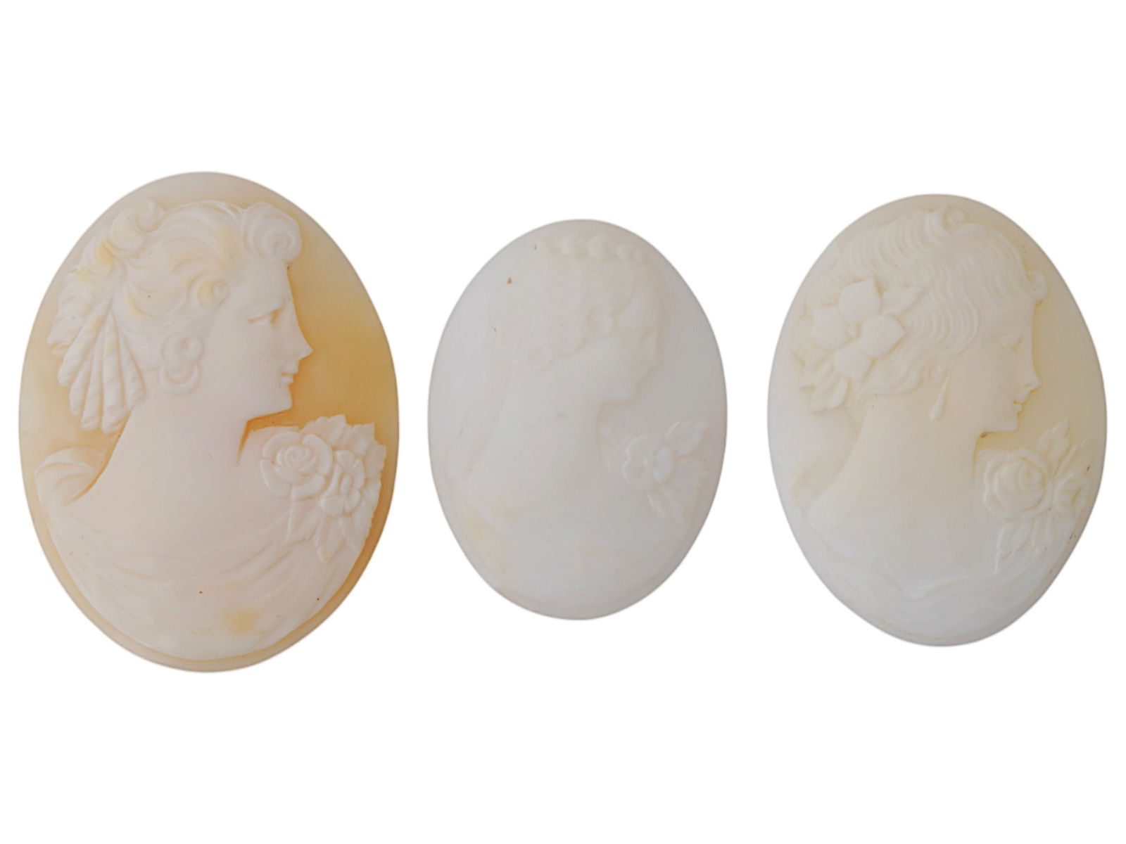 COLLECTION OF PORTRAIT CARVED SHELL CAMEO MEDALLIONS: A collection of three vintage cameo medallions. Each oval cut shell cameo depicts a relief female portrait in profile in the Victorian manner. Vintage Jewelry And Accessories, Intaglios And Cameos, an