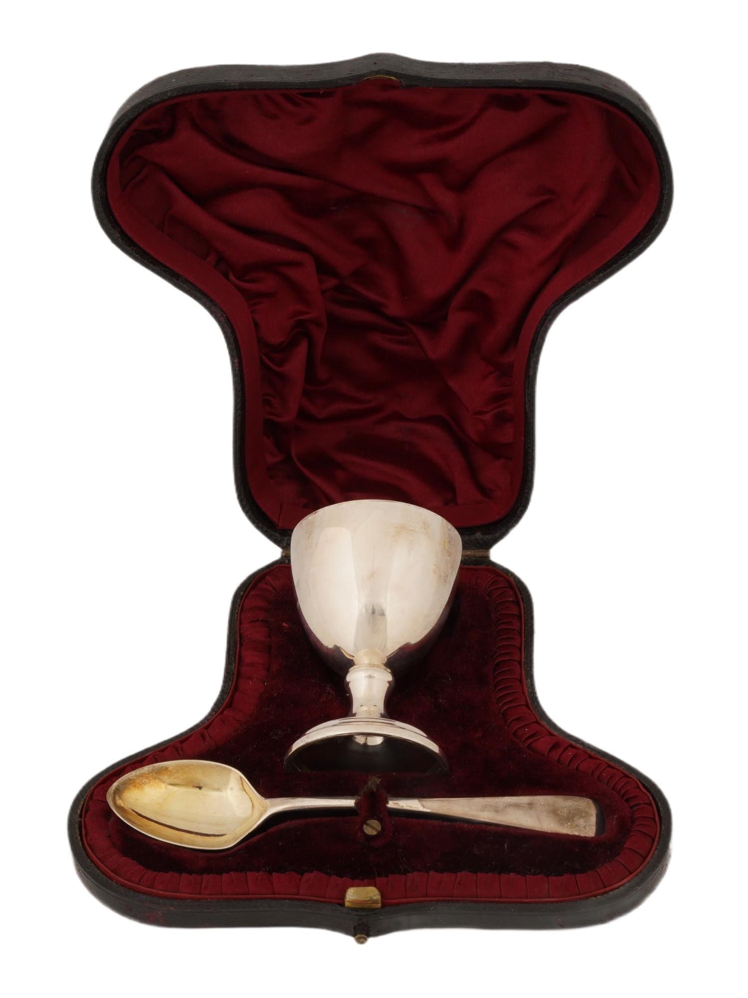 ENGLISH POACHED EGG DISH SPOON SILVER SET IN BOX: An English probably Sheffield silver set of a poached egg dish and a matching small spoon. The poached egg dish is gilded inside, and mounted on a fluted leg. Marked with English Silver hallmarks,
