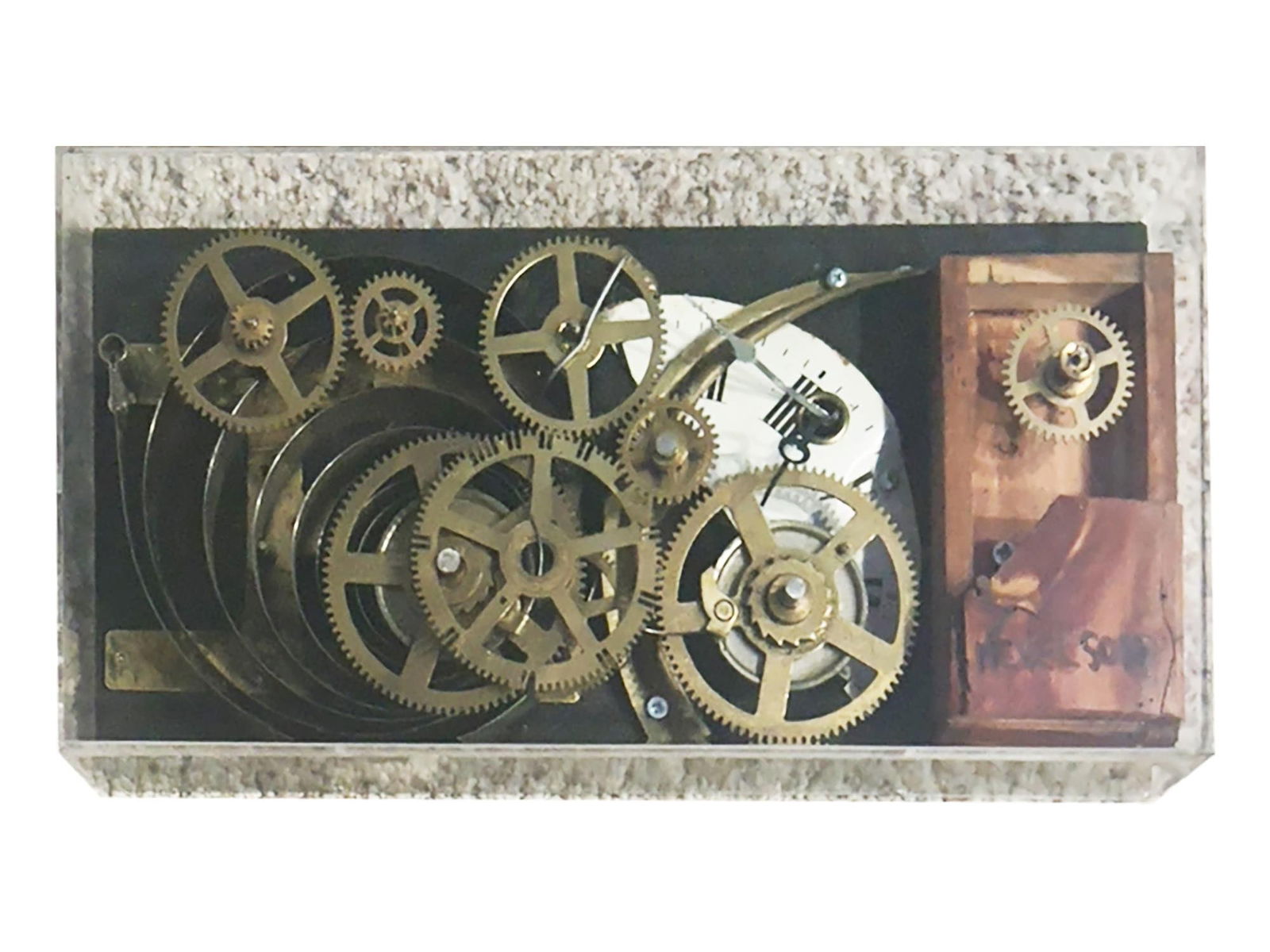 LOUISE NEVELSON SIGNED ASSEMBLAGE SCULPTURE CIRCLE LIFE: This three-dimensional assemblage sculpture by Ukrainian-American artist Louise Nevelson (1899–1988) is composed of vintage clockworks, brass gears, and wooden blocks mounted within a rectangular fo
