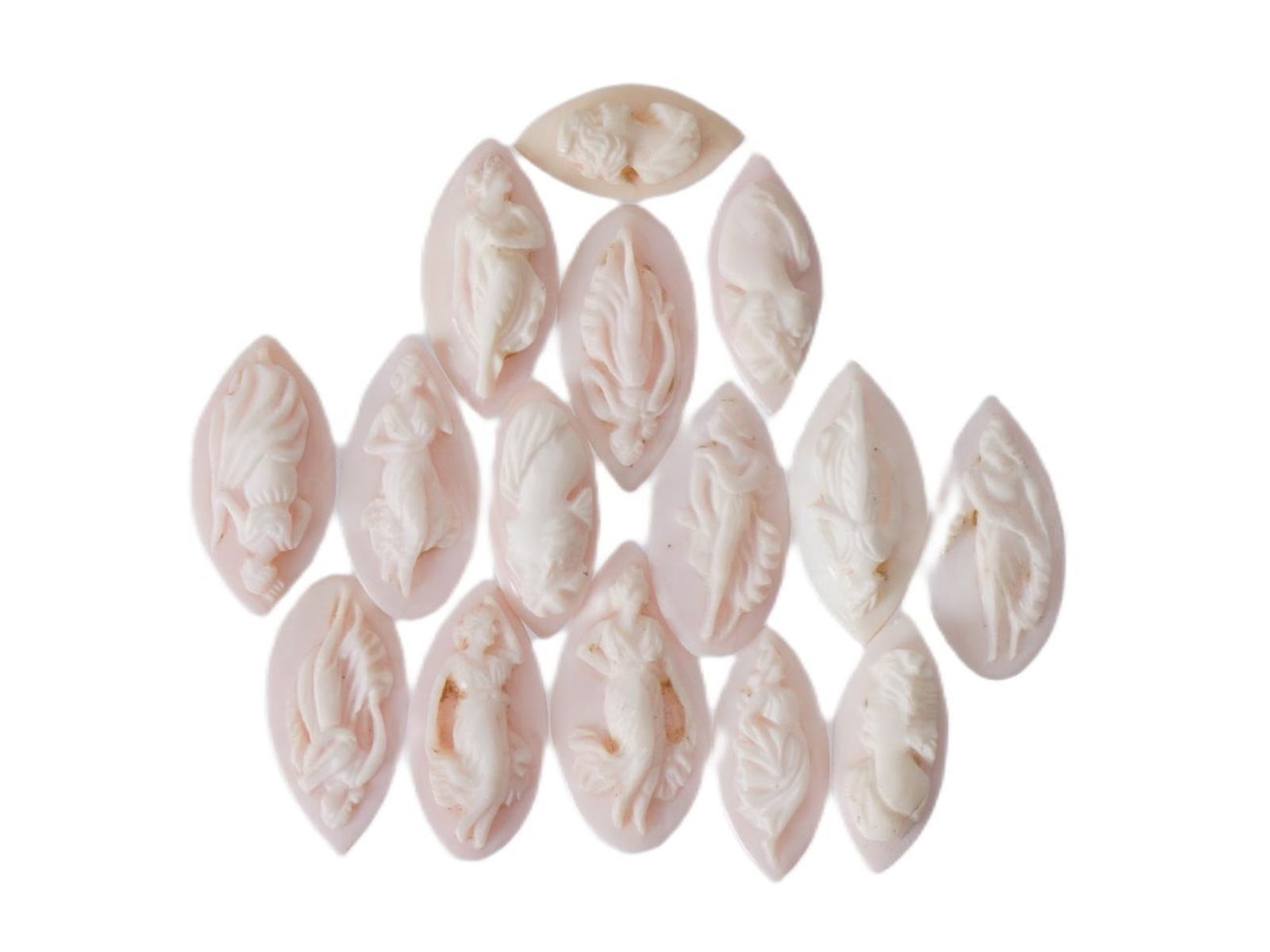 COLLECTION OF 15 HAND CARVED CORAL CAMEOS: A collection of 15 hand carved coral cameos, each featuring a female figure in relief. These carvings are showcasing fine craftsmanship in depicting classical or neoclassical female silhouettes. Such