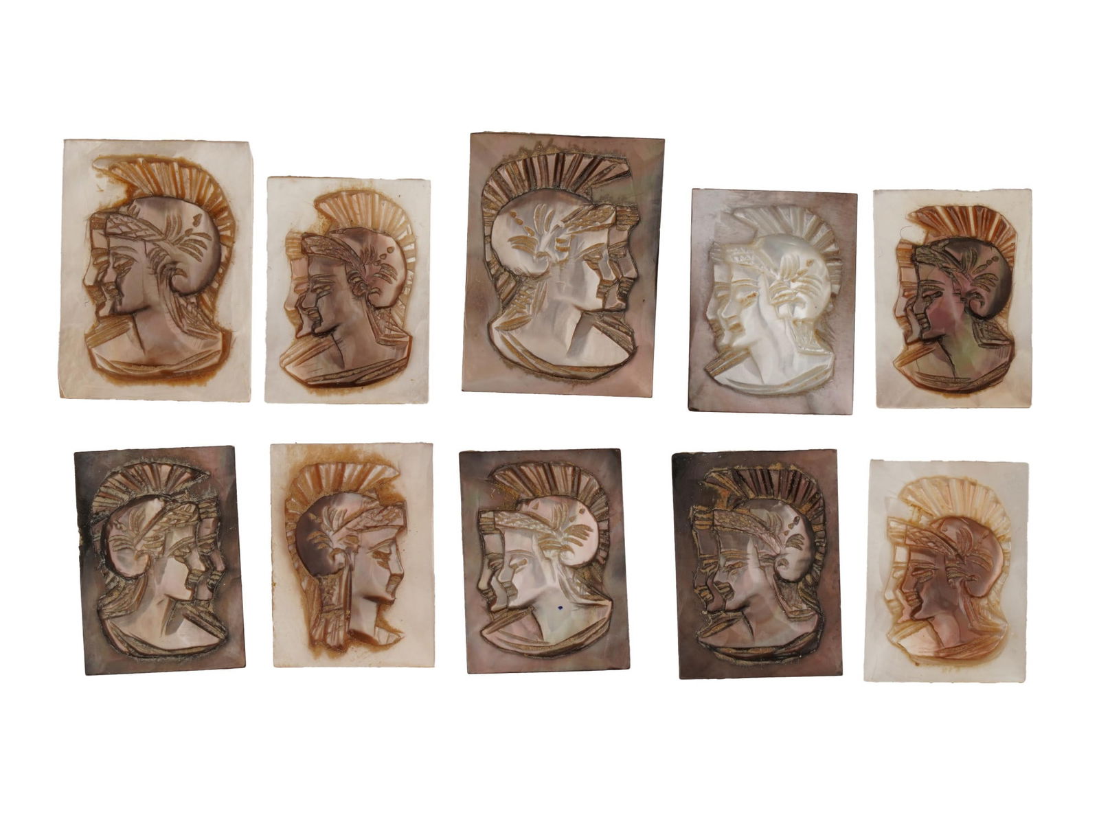 ANTIQUE VINTAGE GRECO ROMAN PROFILE CARVED SHELL CAMEOS: A collection of ten antique or vintage carved shell cameos, each depicting the head profile of a Greco-Roman figure wearing a crested helmet. Carved from a mother of pearl or abalone shell, the pieces