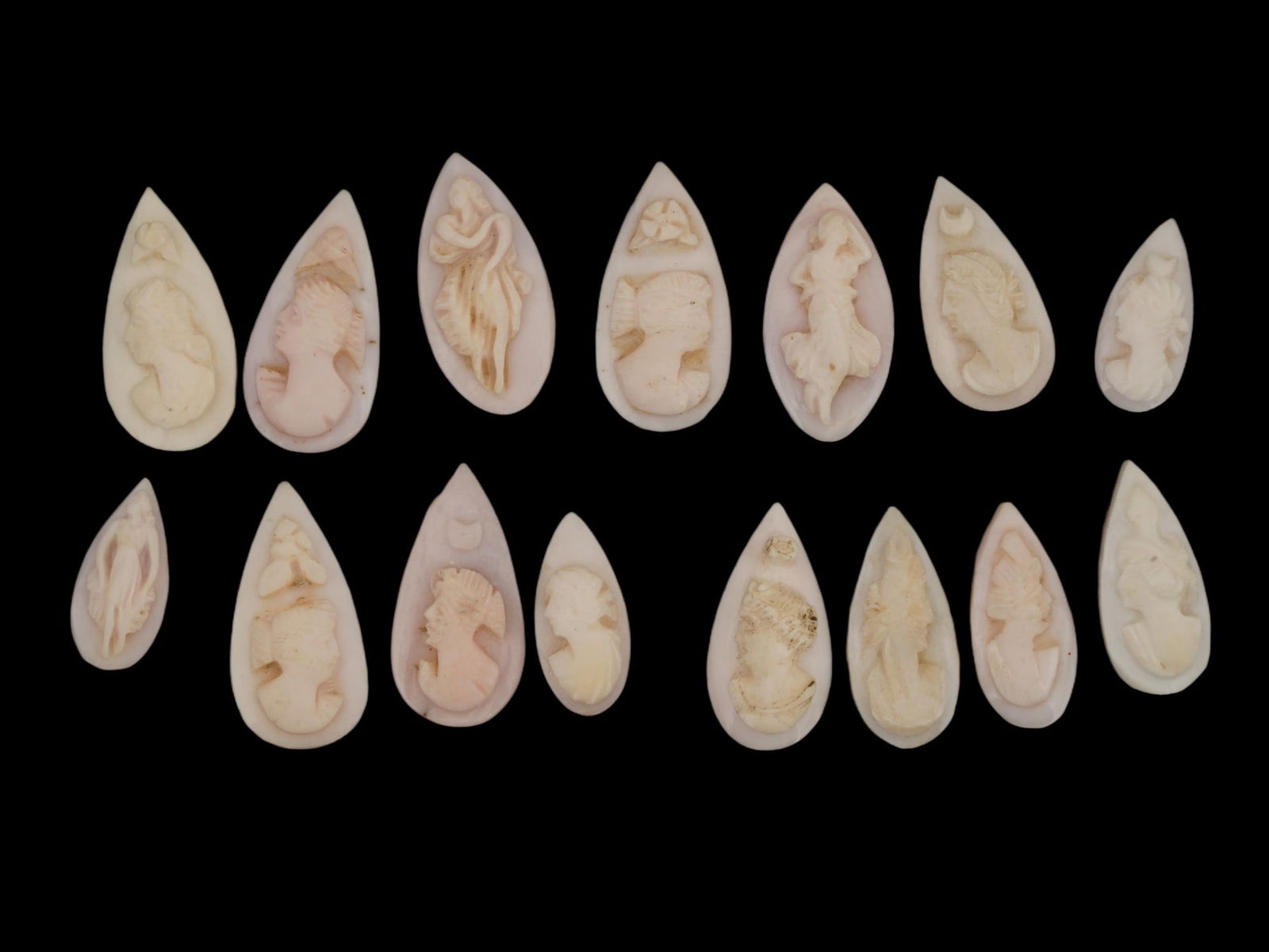 ANTIQUE VICTORIAN HAND CARVED SHELL CAMEO COLLECTION: A collection of 15 antique Victorian hand-carved shell cameos, traditional Italian works of relief sculpture carved from layered conch or helmet shell. The group features a variety of designs, most co