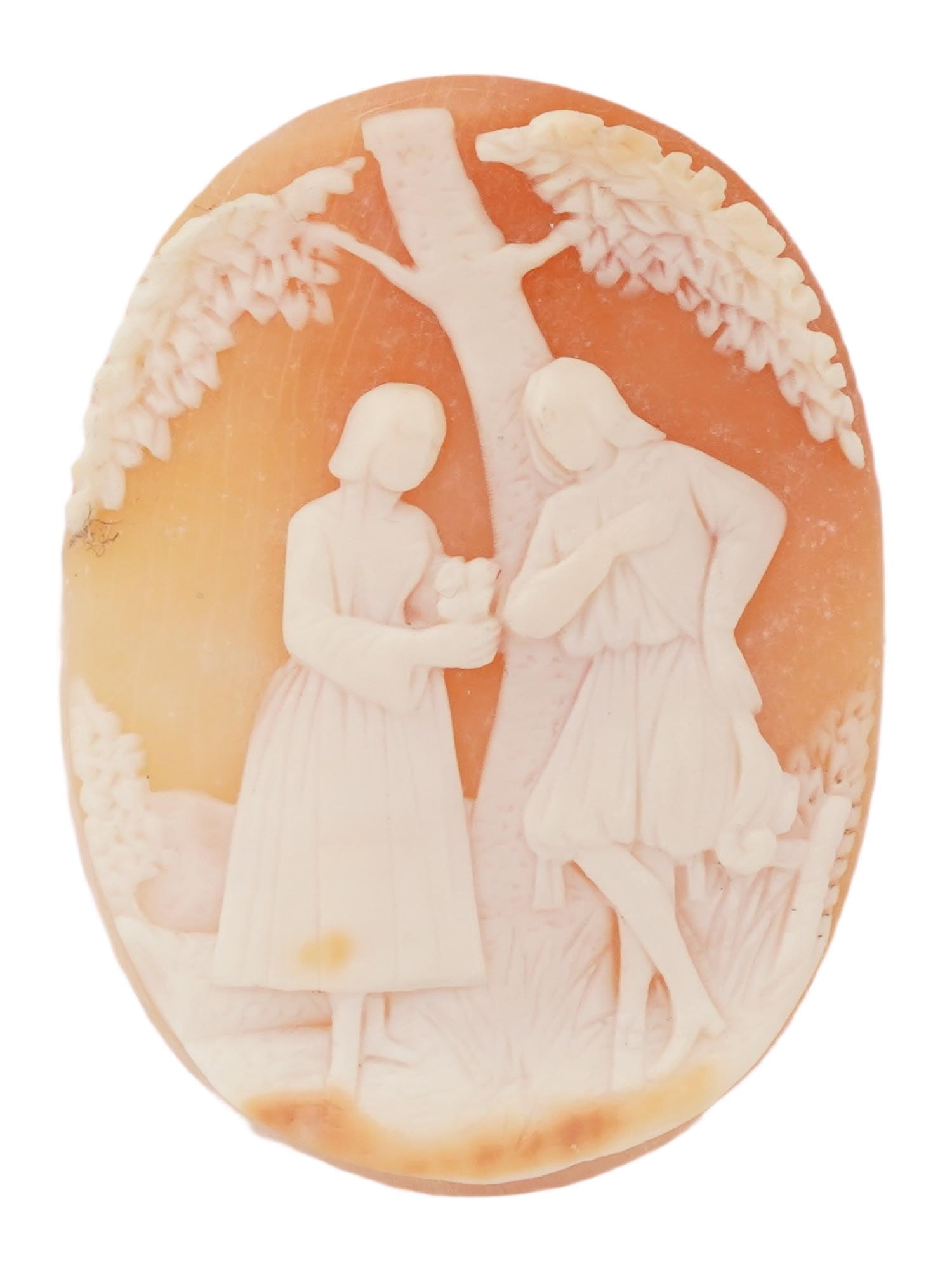 ANTIQUE VICTORIAN CARNELIAN SHELL CAMEO: An antique carnelian shell cameo of oval shape, exquisitely carved with a genre scene including a loving couple against a forest landscape. Victorian Jewelry for Women and Gemstone Carvings. TH