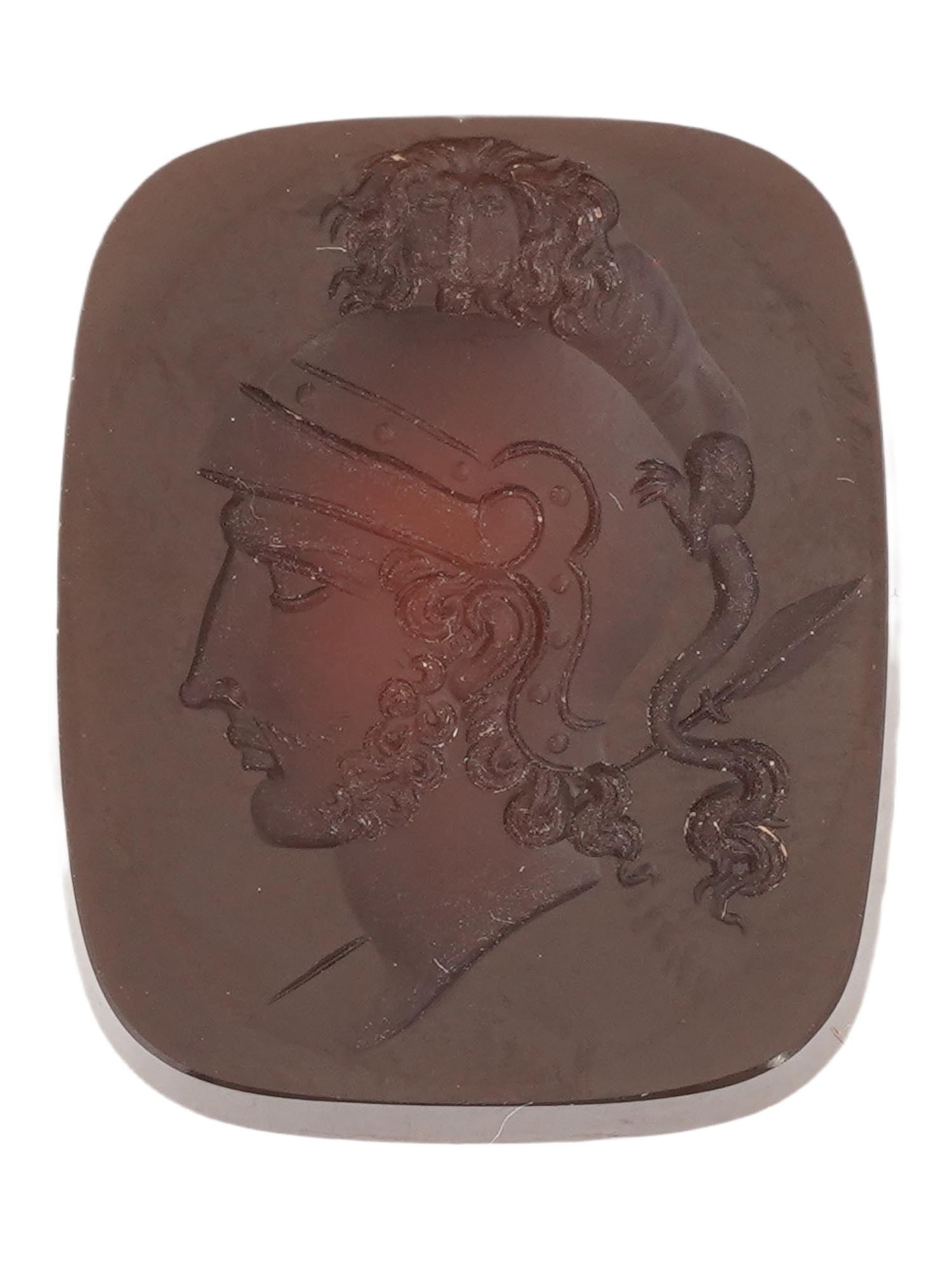 ANTIQUE CARNELIAN MALE PORTRAIT CAMEO: An antique carnelian cameo of rectangular shape, exquisitely carved with a profile portrait of a young warrior in a high helmet facing left. The cameo can be used as a base for a brooch or pendant. Vi
