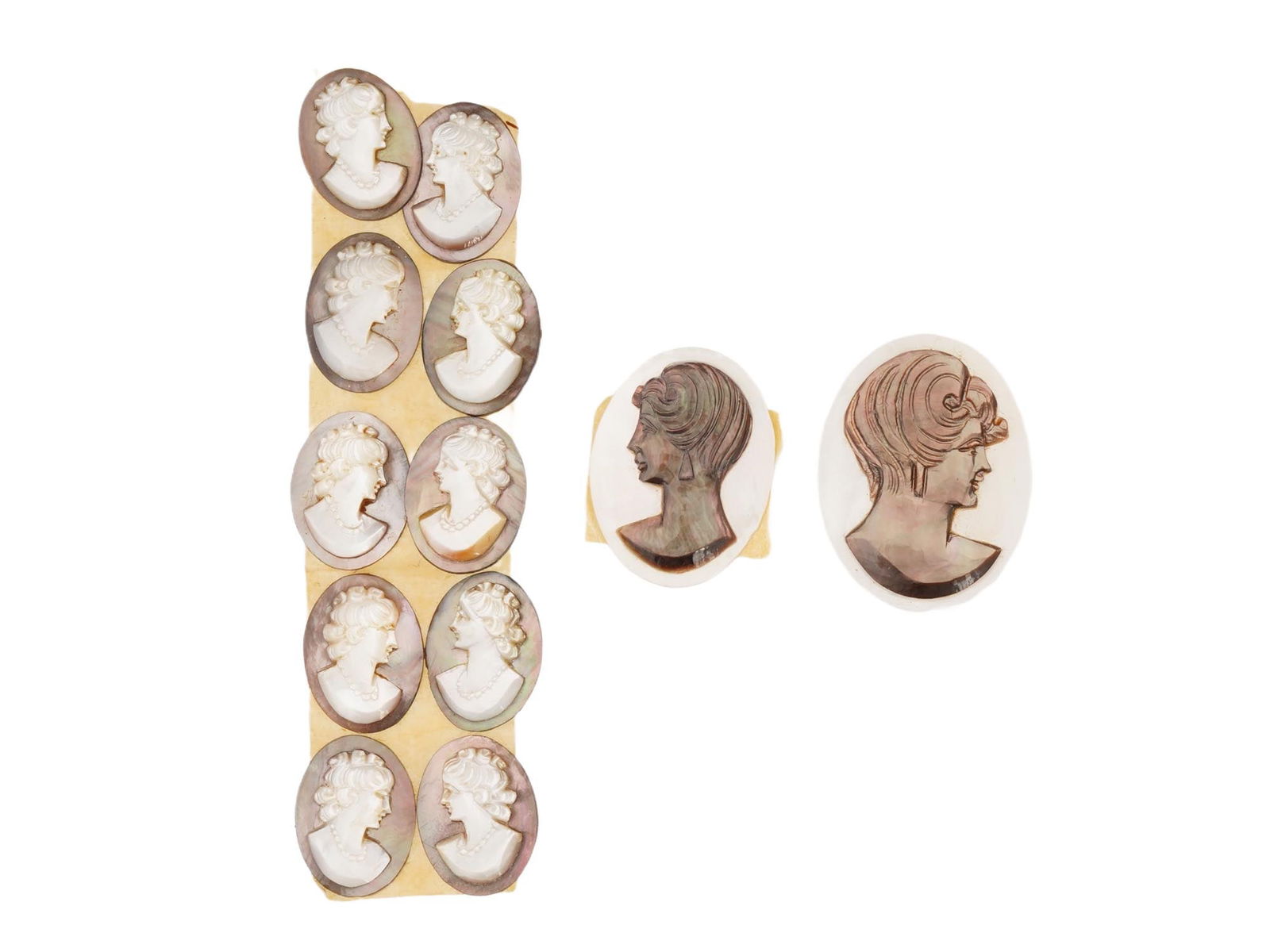 COLLECTION OF ANTIQUE HAND CARVED CAMEOS: A collection of antique hand carved cameos, dating back to the early 20th century. A total of 12 items. Each piece is crafted from conch shell, featuring female profile portraits rendered in high reli