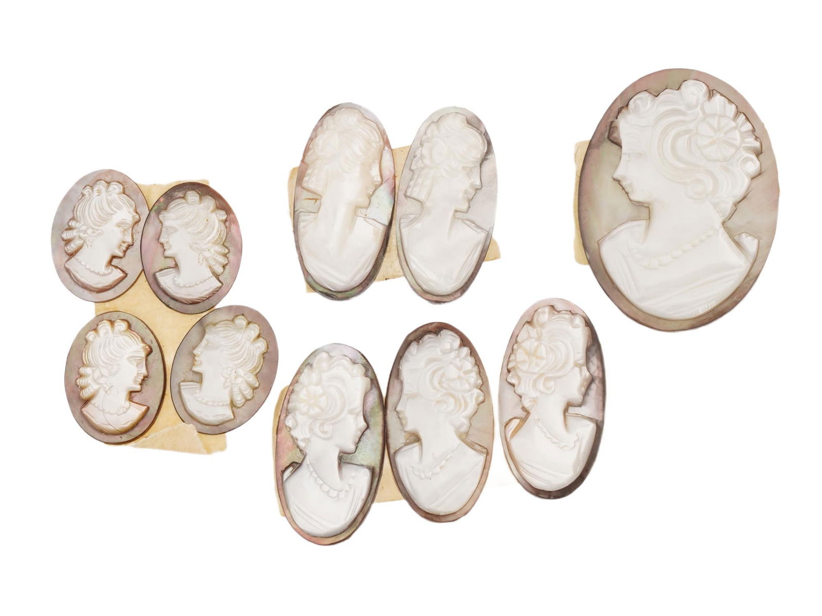 COLLECTION OF PORTRAIT CARVED SHELL CAMEO MEDALLIONS: A collection of 10 assorted vintage cameo medallions in various sizes. Each oval cut shell cameo depicts a relief female portrait in profile in the Victorian manner. Vintage Jewelry and Accessories, I