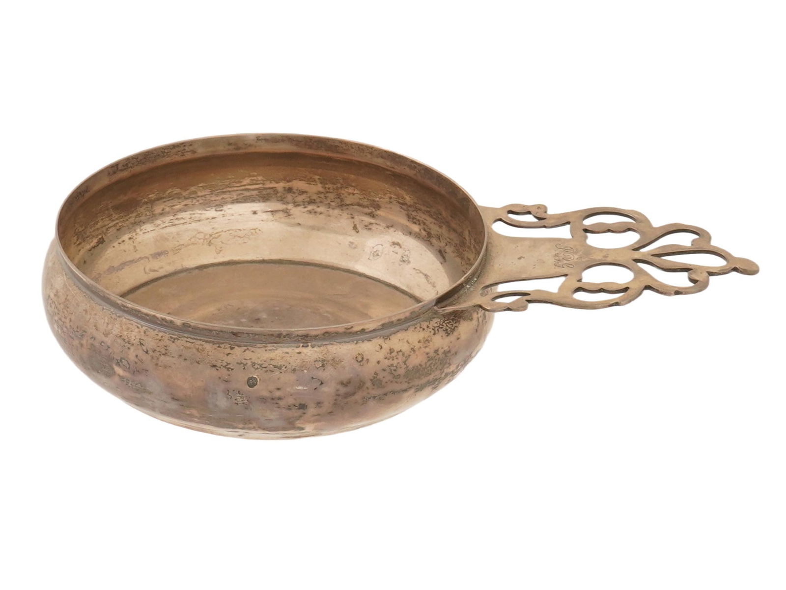 ANTIQUE TIFFANY AND CO STERLING SILVER PORRINGER: An antique late 19th-century sterling silver porringer by Tiffany and Co. Round shallow bowl with pierced handle, featuring an engraved monogram JBG. Hallmarks on the bottom: Tiffany and Co Makers, St