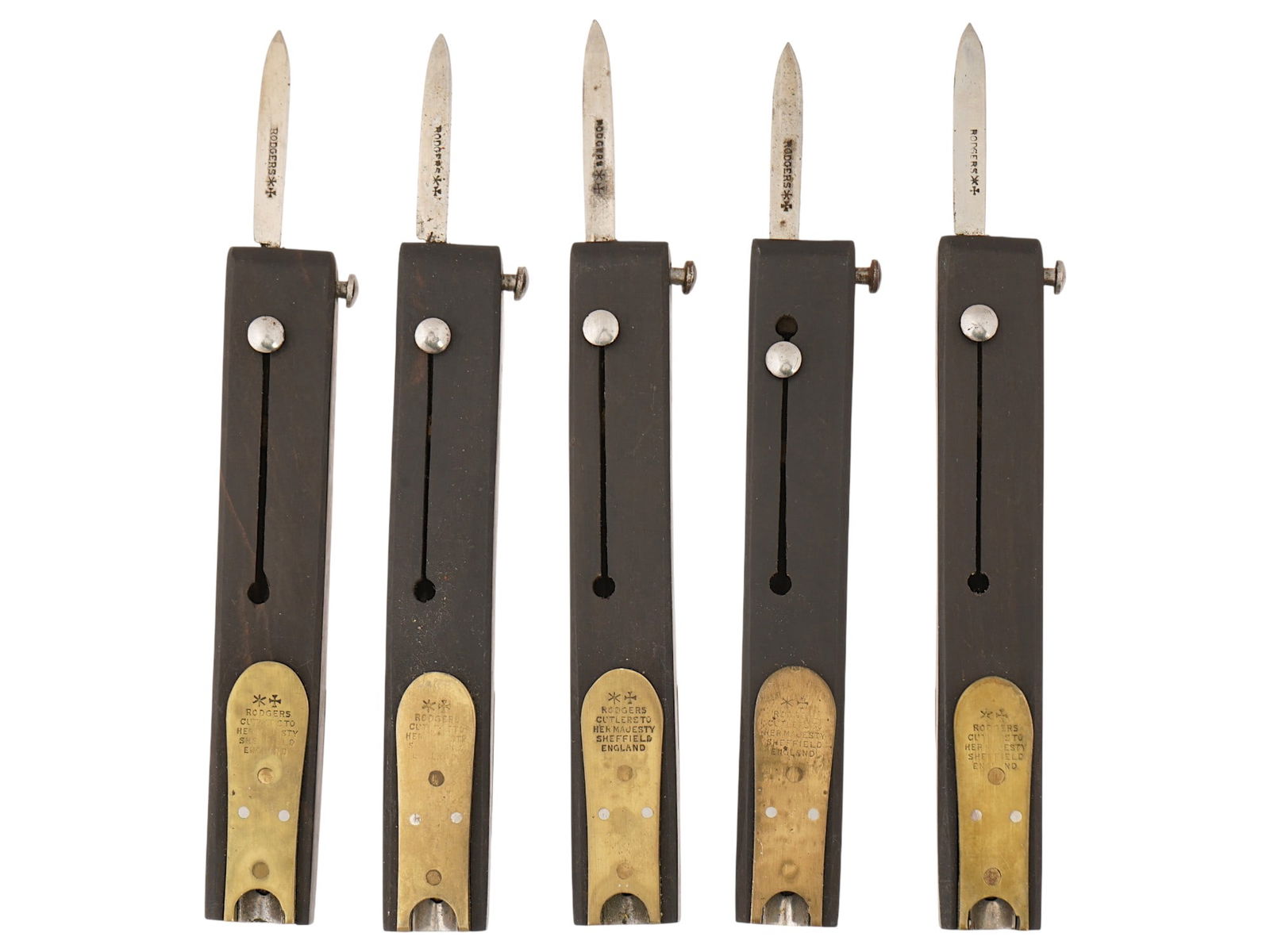 JOSEPH RODGERS AND SONS ANTIQUE MECHANICAL QUILL CUTTERS: A group of five antique Victorian-era mechanical quill cutters made by Joseph Rodgers and Sons in Sheffield, England, likely dating from the mid-to-late 19th century. Joseph Rodgers and Sons, a presti