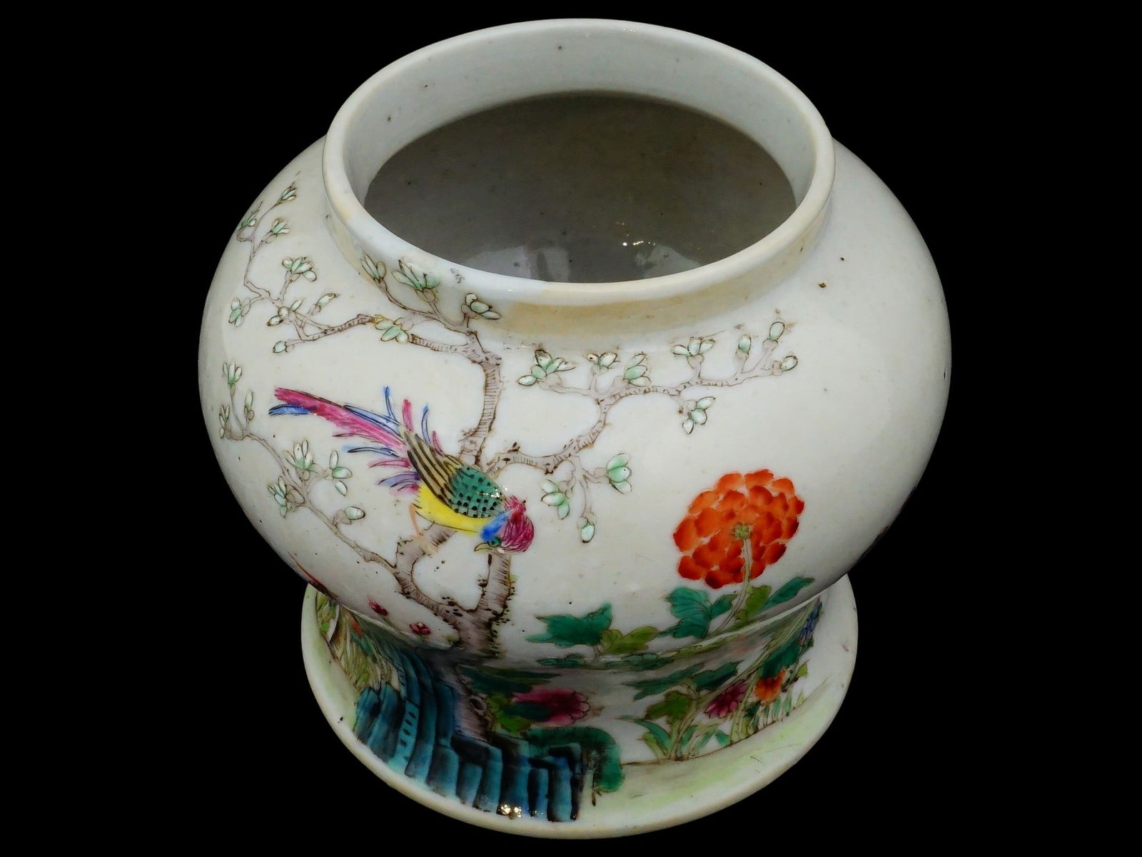 ANTIQUE CHINESE HAND PAINTED PORCELAIN GINGER JAR: An antique Chinese hand painted porcelain ginger jar. The bowl is decorated with beautifully hand painted images of colorful birds among blooming flowers and prunus branches. Marked with red ink Guang