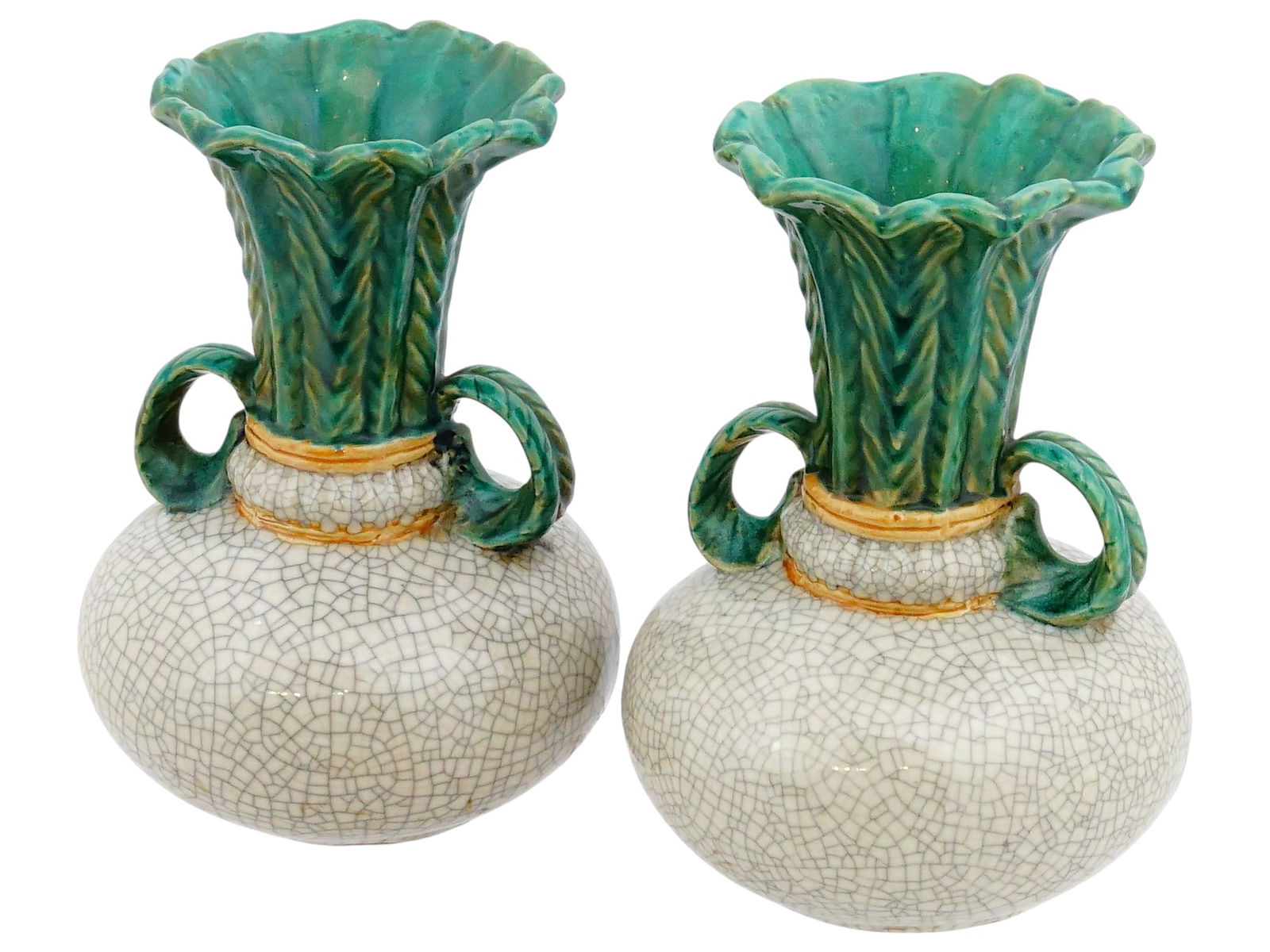 PAIR OF VINTAGE CHINESE TURNIP SHAPED CERAMIC VASES: A pair of vintage Chinese turnip-shaped ceramic vases, distinguished by their bulbous bodies, flared rims, and applied green leaf-form handles extending from the neck to the shoulder. The surfaces dis