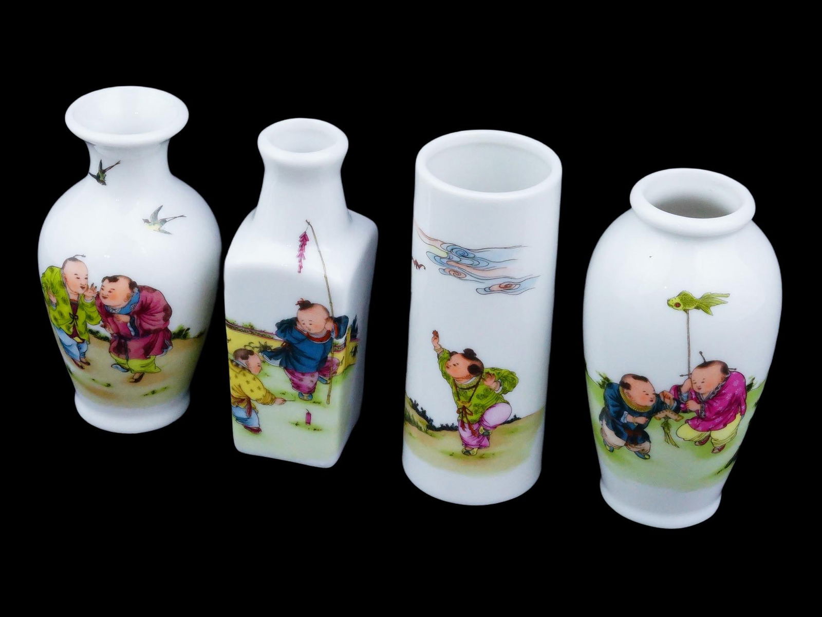 SET OF 4 VINTAGE CHINESE HAND PAINTED MINIATURE VASES: This set features four distinct miniature porcelain vases, including a baluster, square bottle, cylindrical, and ovoid form, each hand-painted with charming "100 Boys" motifs depicting children playin
