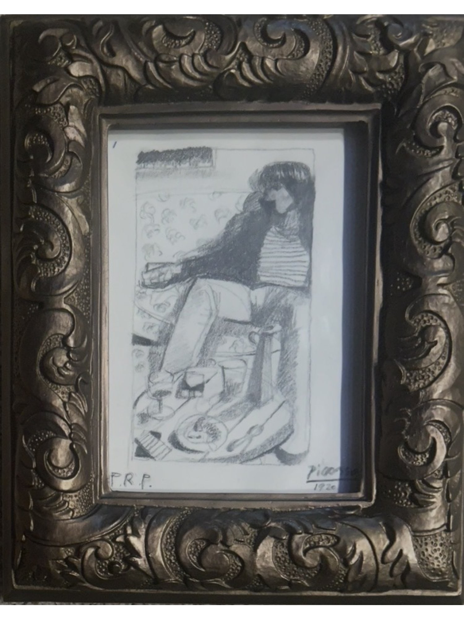 ATTR TO PABLO PICASSO GRAPHITE PORTRAIT 1920: A graphite on paper composition titled Portrait dune femme, depicting a seated figure at a table. The work bears a Picasso signature with the date 1920 in the lower right and the initials P.R.P. at lo