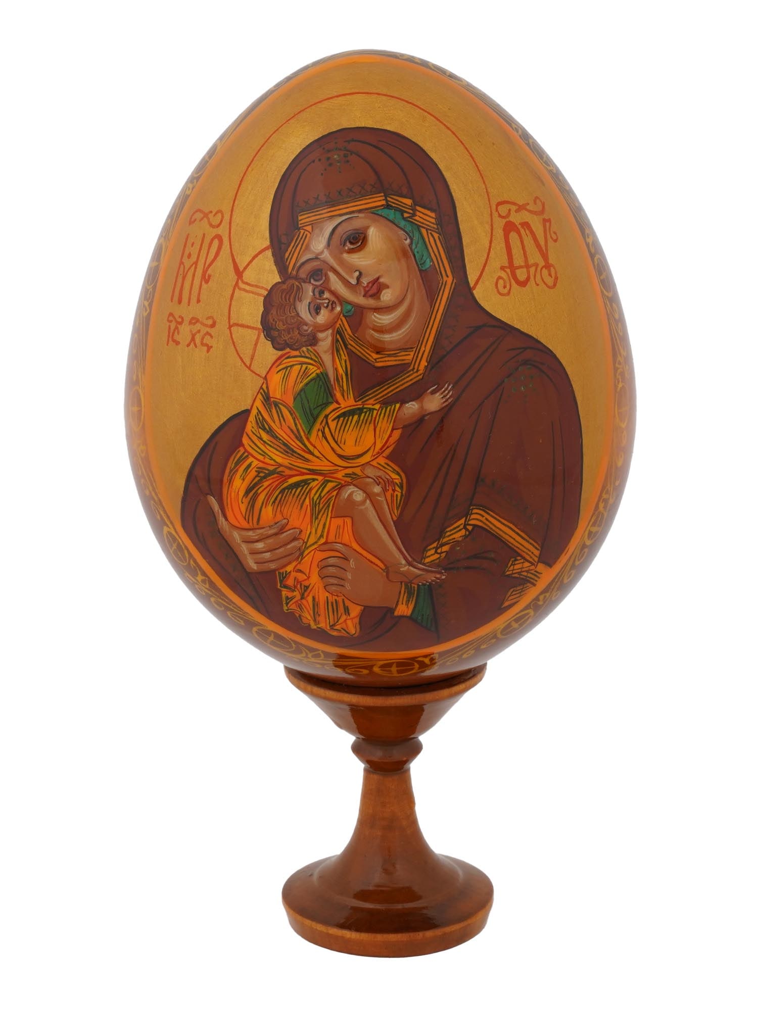 VINTAGE RUSSIAN LACQUERED EASTER EGG W MINIATURE ICON: A vintage Russian Orthodox Easter decor, a lacquered wooden egg on stand. The egg is garnished with a hand-painted icon of Virgin Mary and Jesus Child on the obverse and Orthodox cross on the reverse.