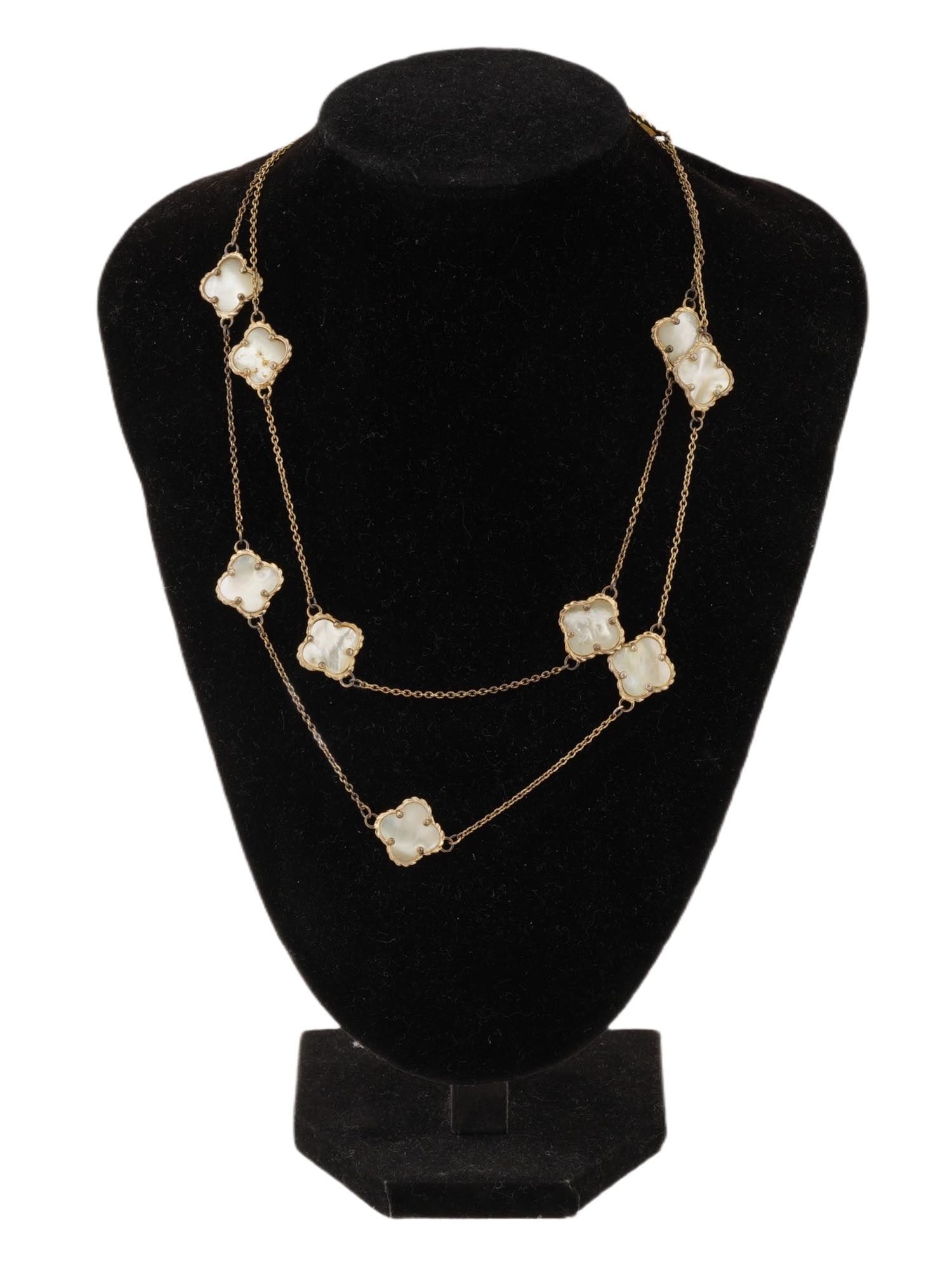 VINTAGE GILT SILVER AND MOTHER OF PEARL NECKLACE: A vintage gilt silver and mother of pearl necklace. The necklace consists of a double-strand silver chain alternating with mother-of-pearl elements in the shape of a four-leaf clover. Marked with a si