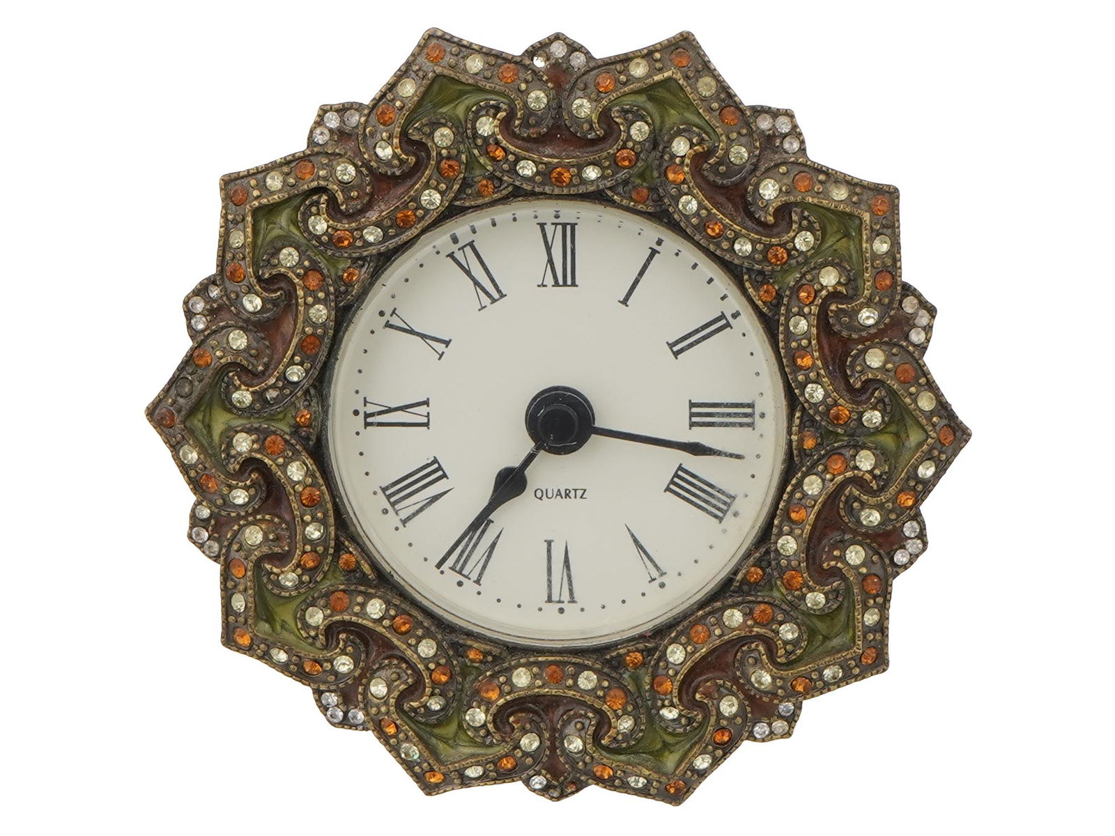ANTIQUE TABLE CLOCK: ANTIQUE Running Beautiful sparkles and glows in the sunlight . Topaz Peridot gems. The back is borderlands of hearts and it does run Aquired in 1955. Dimensions D 3 in. Dia