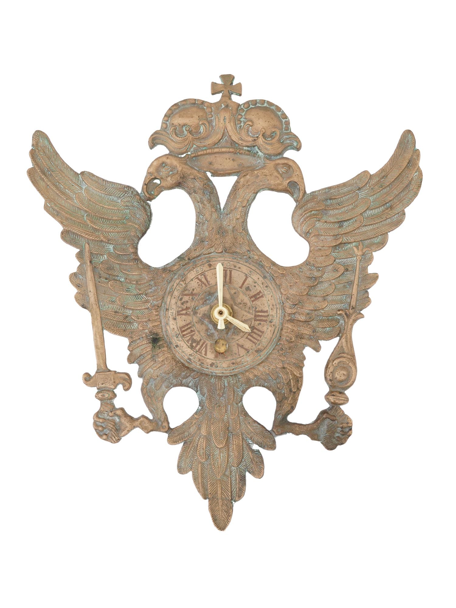 ANTIQUE RUSSIAN IMPERIAL ROMANOV BRASS CLOCK FACE: An antique Russian Imperial Romanov brass clock face in the shape of the double headed eagle. The eagle is crowned and holds a sword and scepter. The clock face is set within the eagles chest and has