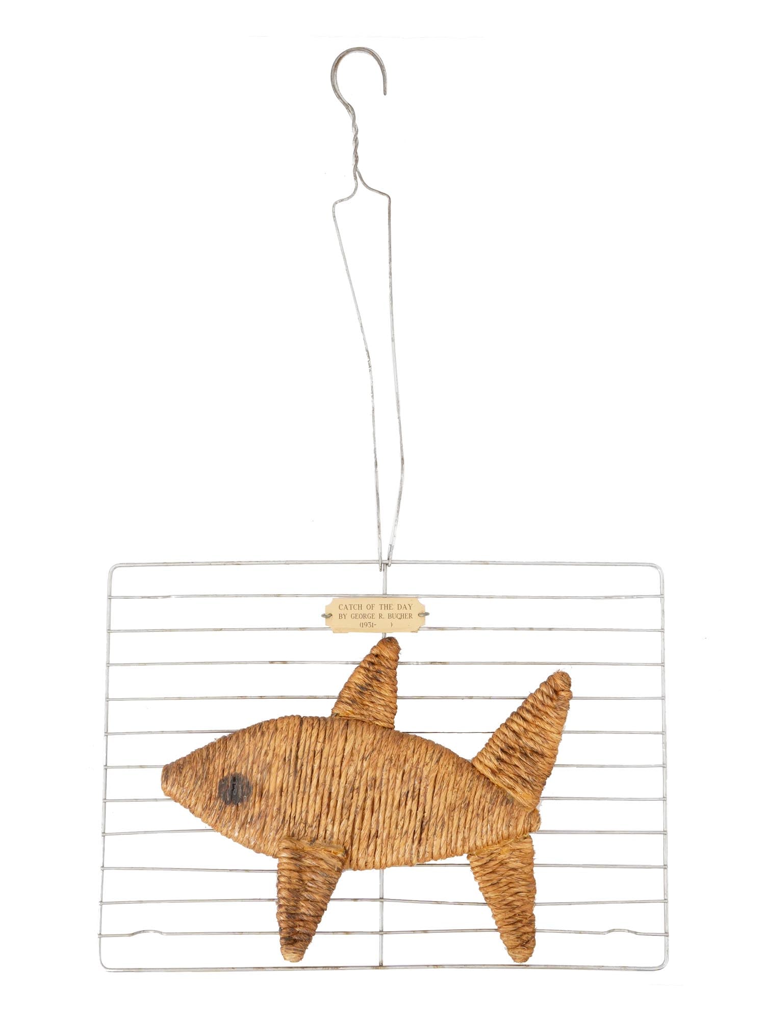 VINTAGE ROPE SCULPTURE BY GEORGE ROBERT BUCHER: A vintage rope sculpture by George Robert Bucher, 1931 to 2015, an American Pennsylvanian sculptor and educator. The artwork titled Catch of the Day features a fish sculpture attached to the wire shel