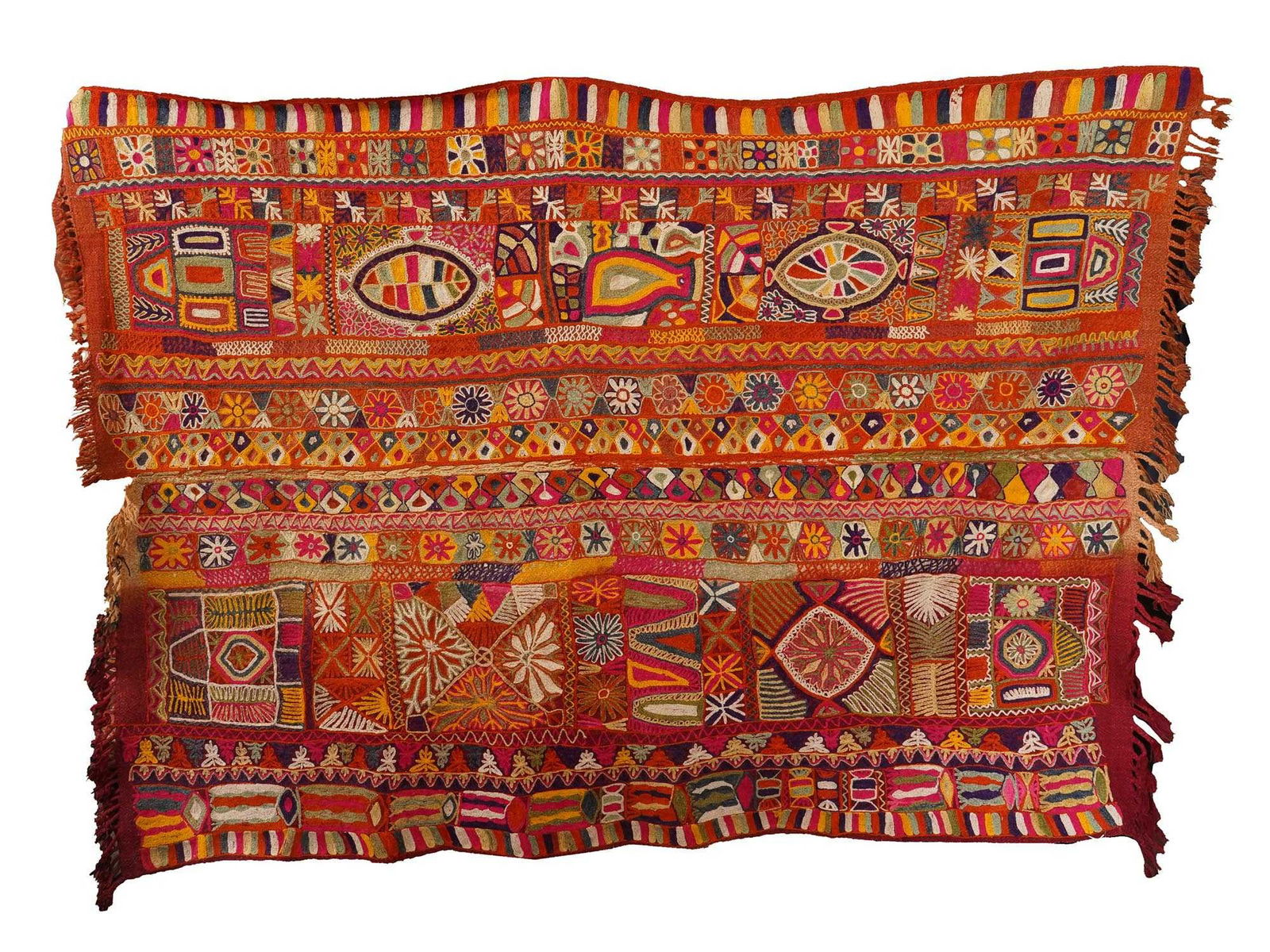 ANTIQUE IRAQI TRIBAL WEDDING EMBROIDERED BLANKET: An antique tribal wedding blanket. The blanket has a rectangular shape and features an intricate embroidered pattern. The color palette is rich and vibrant, with warm tones of red, orange, and yellow,