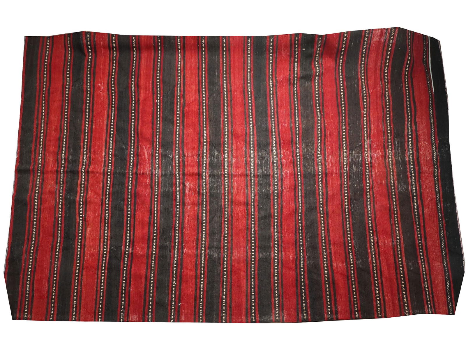 VINTAGE TURKISH KILIM AREA RUG TEXTILE: A vintage Turkish kilim area rug. The design features a series of vertical stripes in alternating colors of red and black. Within the black stripes, there is a thin white line interspersed with small,