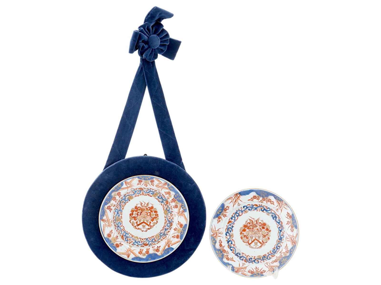 PAIR MATCHING ANTIQUE CHINESE EXPORT PORCELAIN PLATES: A pair of matching antique Chinese Export porcelain plates. Qing Dynasty, 18th century. The round white plate with an elegant pattern in red and azure blue with gold accents based on European coats of