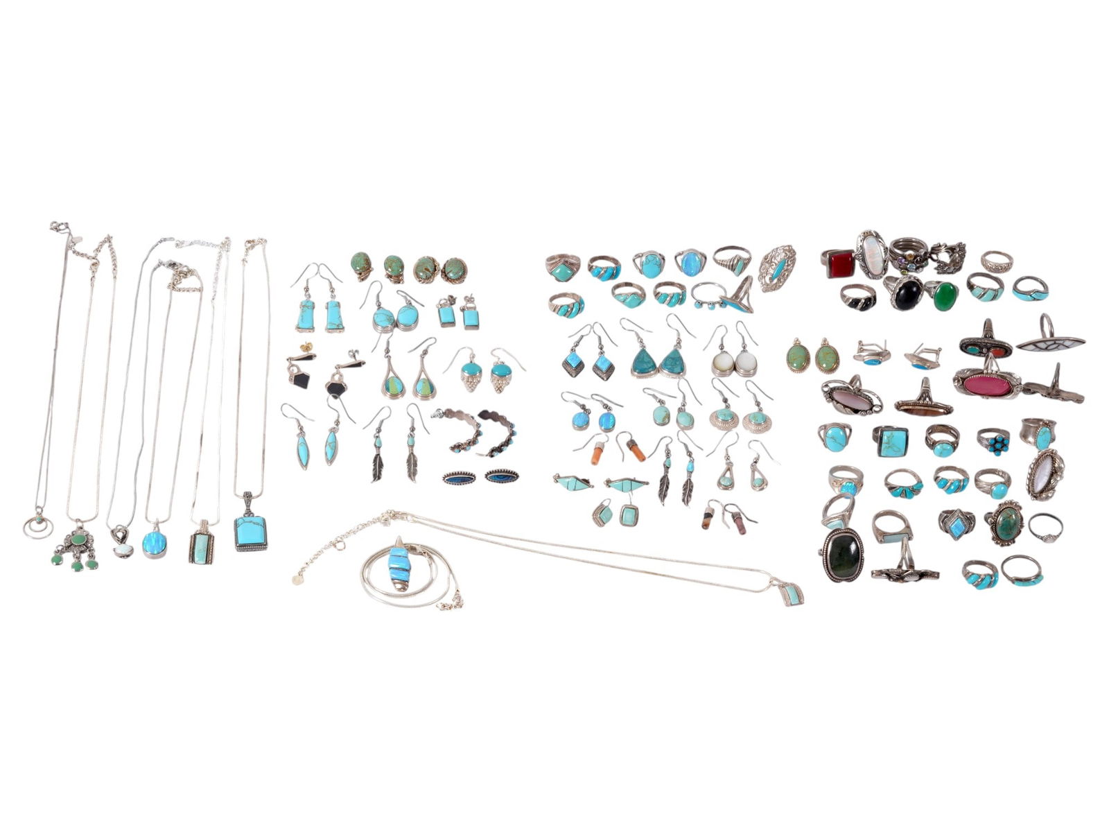 VINTAGE AMERICAN SILVER OLD PAWN STYLE JEWELRY PIECES: A collection of 80 vintage sterling silver American old pawn style jewelry pieces, comprising 46 rings, 26 earrings, and 8 pendants, primarily in Southwestern and Native American-inspired designs. The