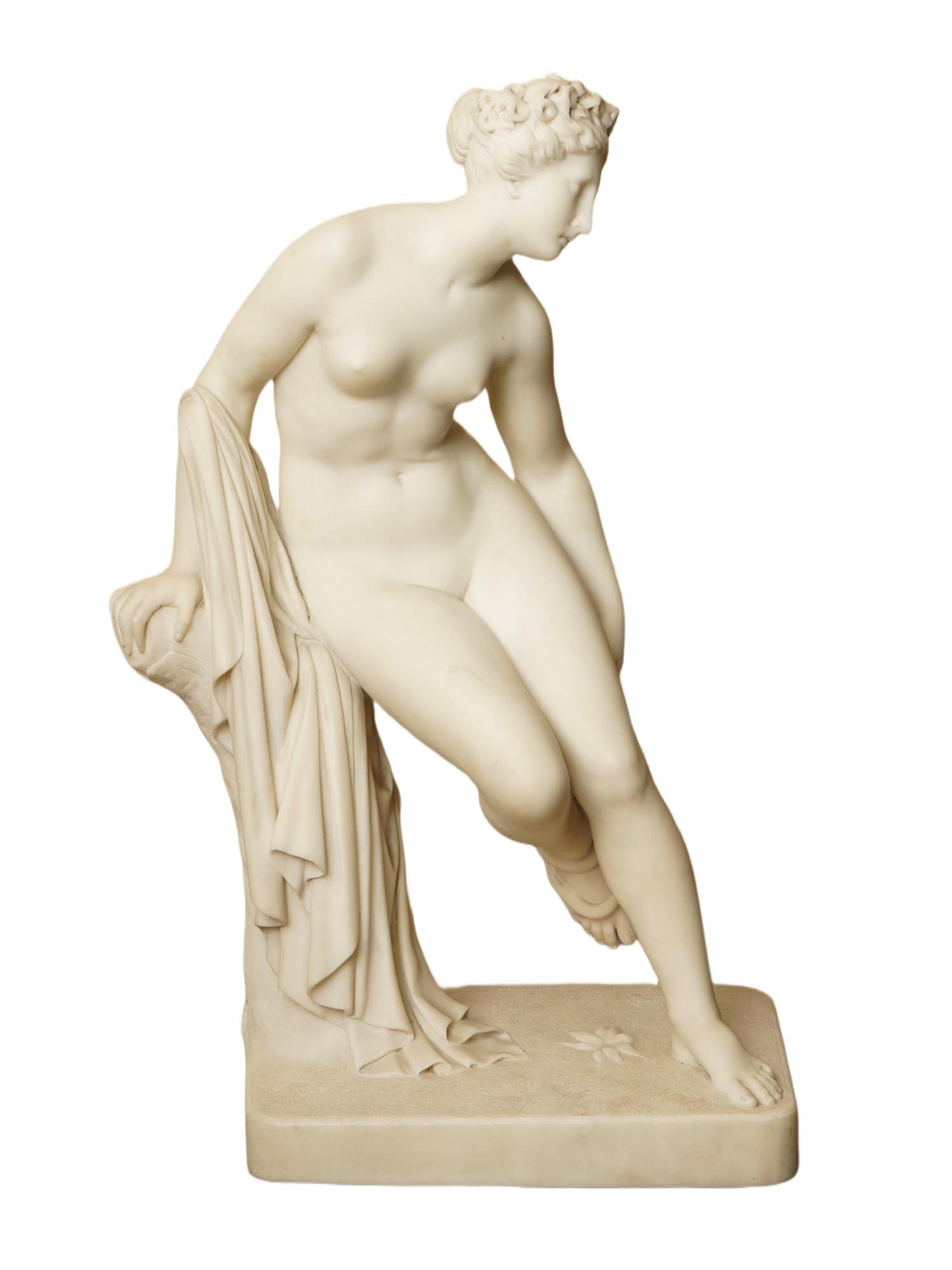 EUROPEAN ITALIAN VENUS MARBLE SCULPTURE: A fine European Italian marble sculpture. The sculpture depicts Venus, the goddess of love, leaning against a tree after bathing, with a snake coiled around her leg. Raised on the base. Unsigned. Clas