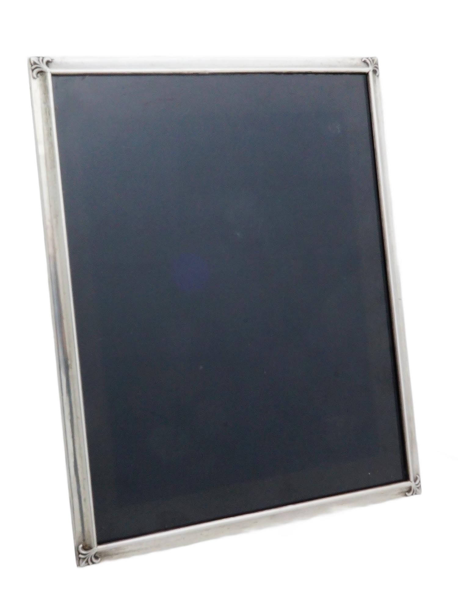 SPANISH ISABEL CABANILLAS STERLING SILVER PHOTO FRAME: A handcrafted sterling silver photo frame by Spanish artisan Isabel Cabanillas S.A. The piece features an acanthus motif at each corner, delicately embossed in a classical style reminiscent of early