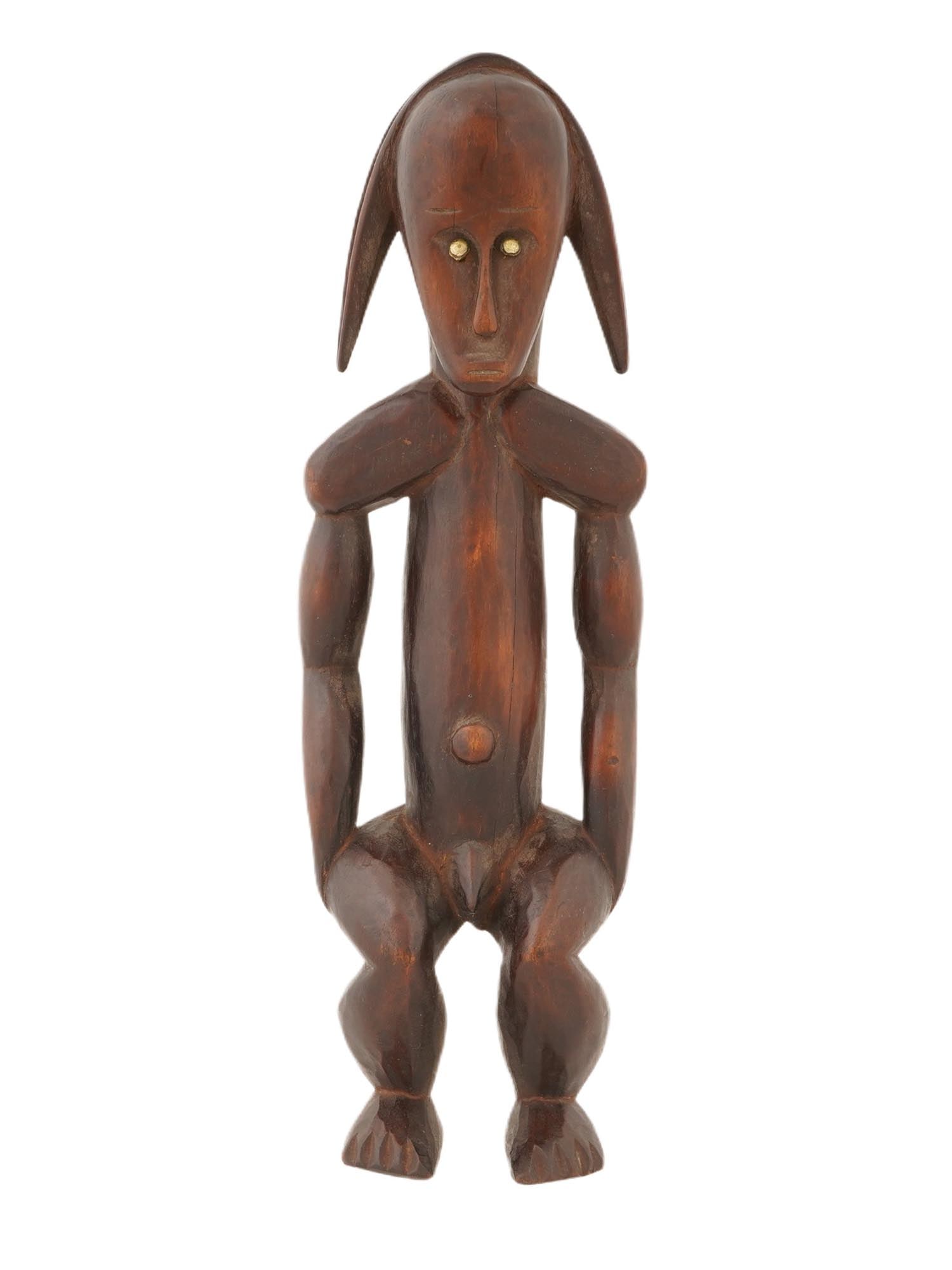 CENTRAL AFRICAN FANG PEOPLE BYERI RELIQUARY FIGURE: A Central African Fang people Byeri reliquary figure from Gabon. Represents a hand carved male figure with exaggerated physical features. The face is bounded from above by high semicircles of eyebrows