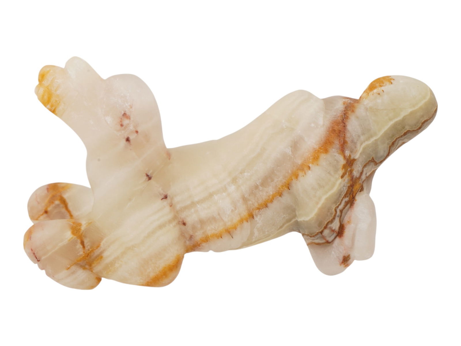 ANCIENT PRE COLUMBIAN TAINO STONE ZOOMORPHIC FIGURINE: An ancient Mesoamerican hand-carved hardstone sculpture. Taino culture. The zoomorphic figurine, presumably made of onyx with red veins, is modeled in the form of a kneeling animal. Pre Columbian Hist