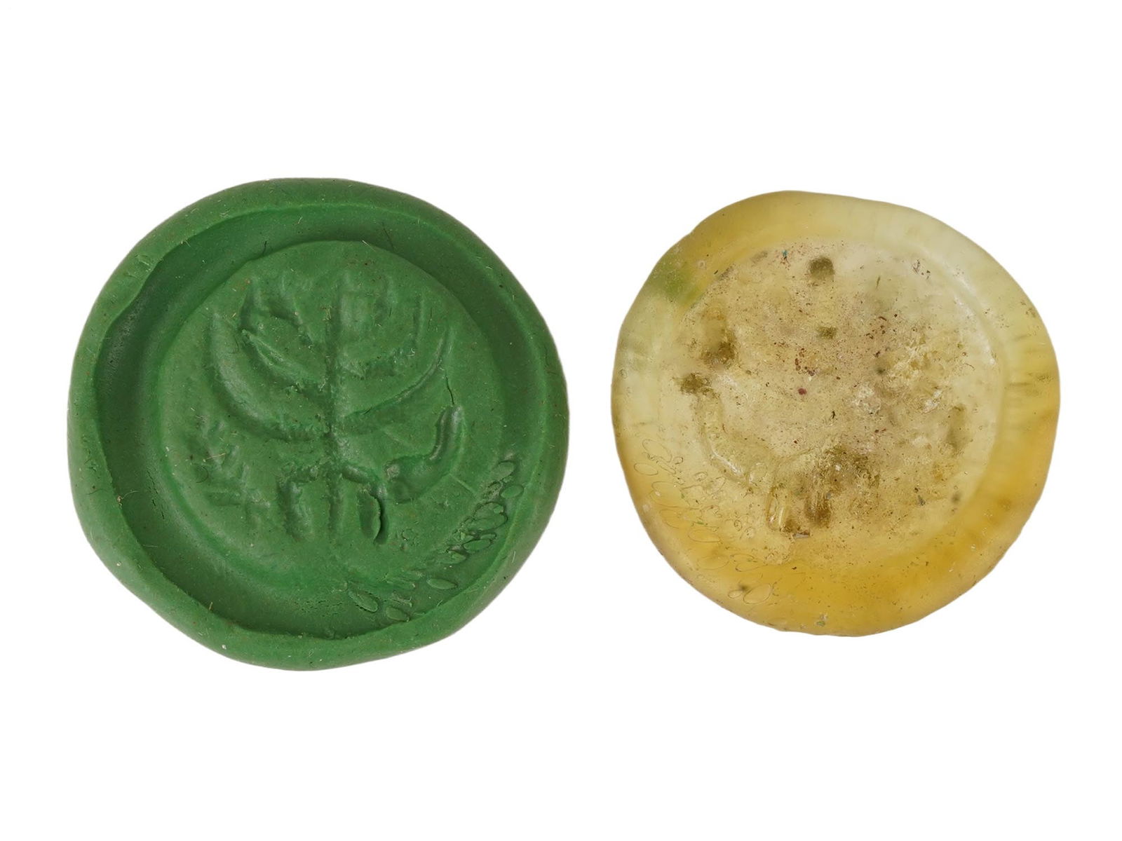 ANCIENT ROMAN GLASS MEDALLION WITH JUDAICA MENORAH: An ancient Roman glass medallion featuring a Judaica menorah motif, dating circa 100 to 300 AD, reflecting early religious symbolism within the Roman world. Formed in translucent glass with molded dec