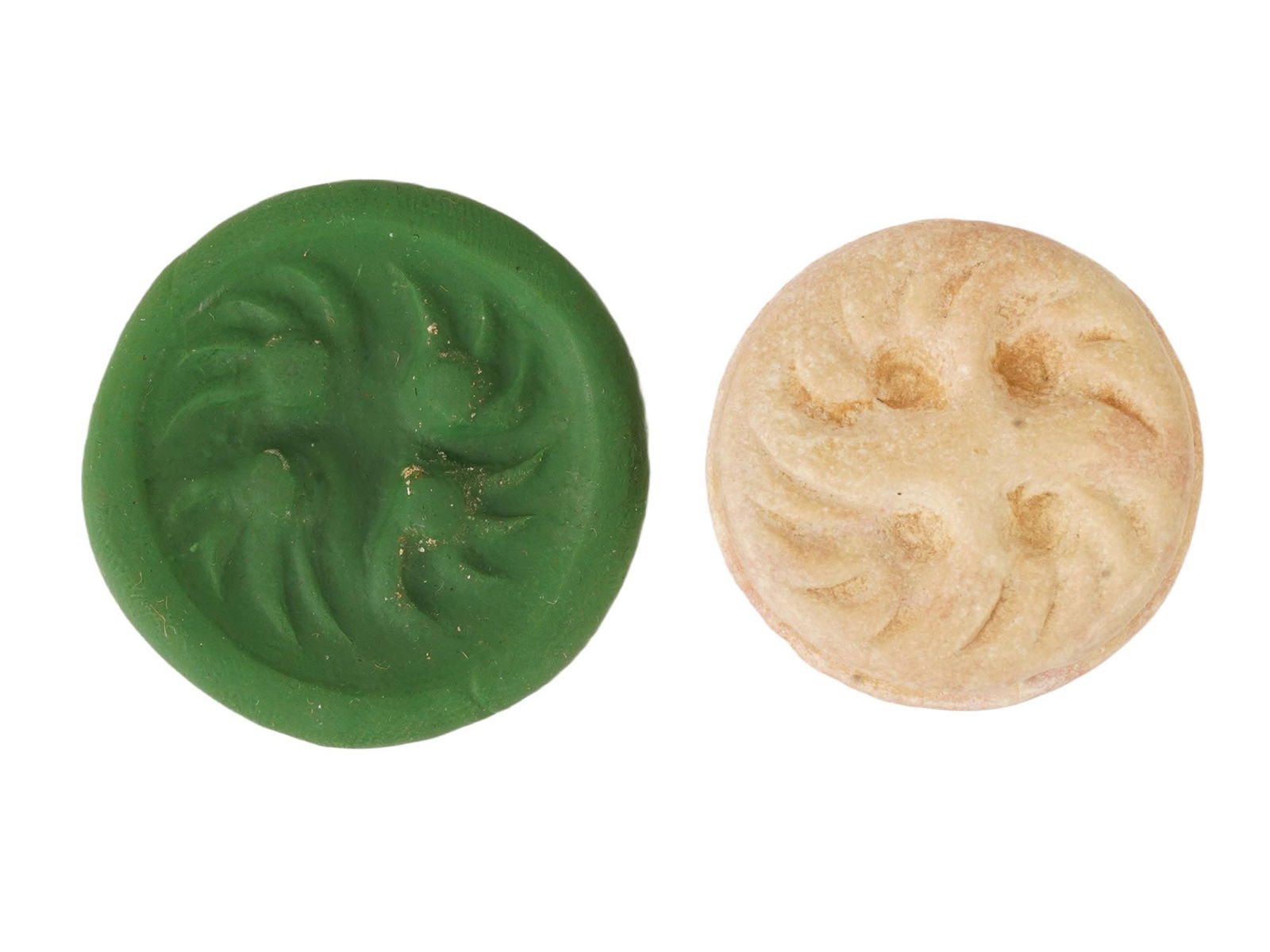 ANCIENT WESTERN ASIATIC CARVED MARBLE STAMP SEAL BEAD: An ancient Western Asiatic carved marble stamp seal bead. Circa the late 3rd to early 2nd millennium BCE. The seal features a characteristic swirling spiral motif on its circular face. Archaeological