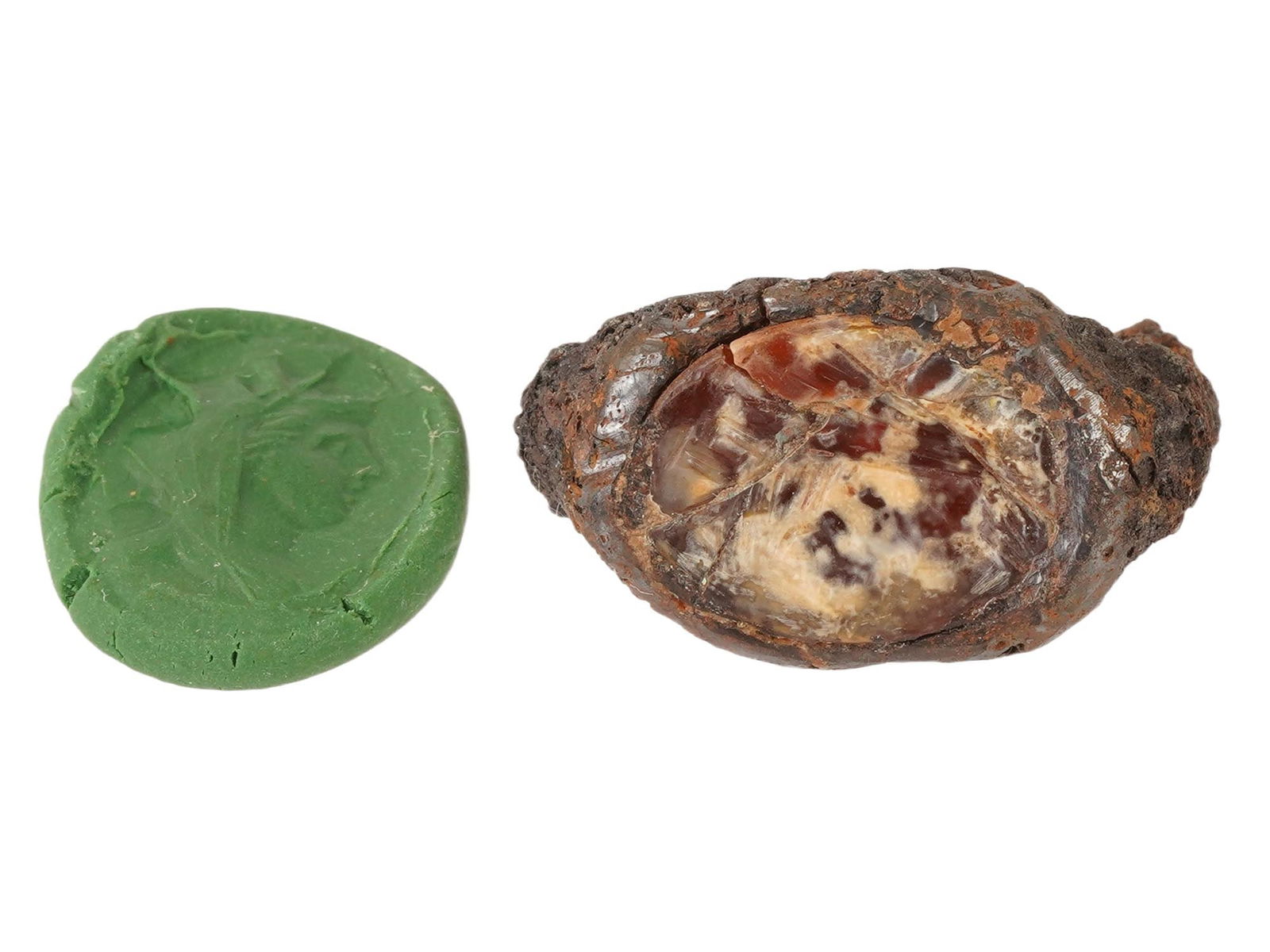 ANCIENT ROMAN AGATE INTAGLIO OF THE GODDESS TYCHE: An ancient Roman agate intaglio depicting the goddess Tyche, set within a fragment of a ring, dating circa 100 BC to 200 AD. The carved gemstone features a classical profile rendered in intaglio techn