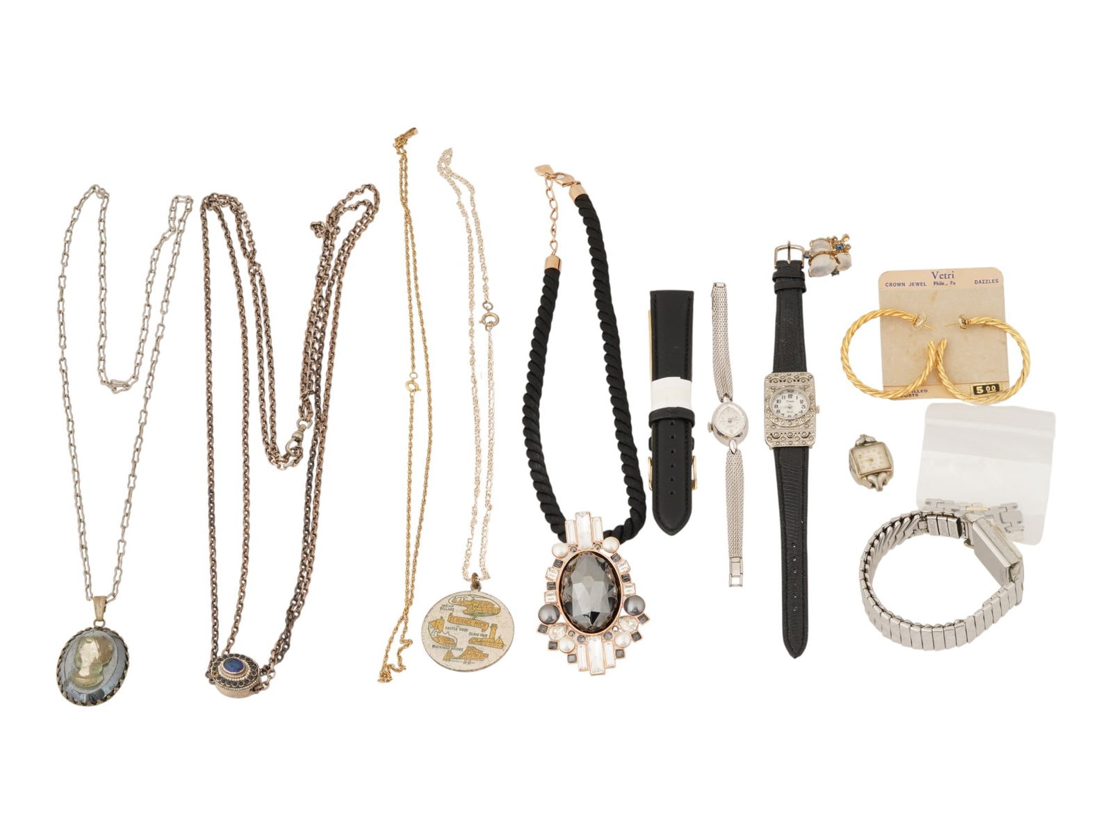 GROUP OF VINTAGE AND DESIGNER JEWELRY AND ACCESSORIES: An assorted collection of vintage and designer jewelry and accessories, including statement necklaces, classic earrings, and Art Deco–style timepieces. The centerpiece is a necklace, featuring a dra