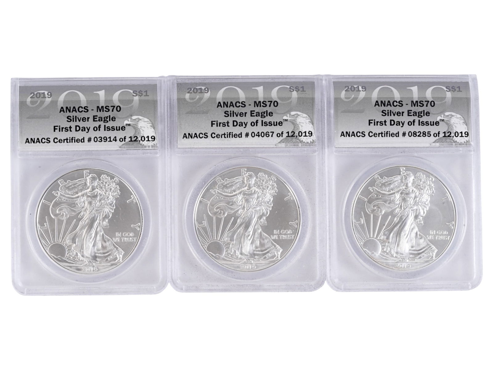 2019 AMERICAN SILVER EAGLE COINS MS70 GRADED FIRST DAY: A set of three 2019 American Silver Eagle coins, each certified MS70 First Day of Issue by ANACS and encapsulated in their original protective holders. Struck in 1 oz of .999 fine silver with a legal