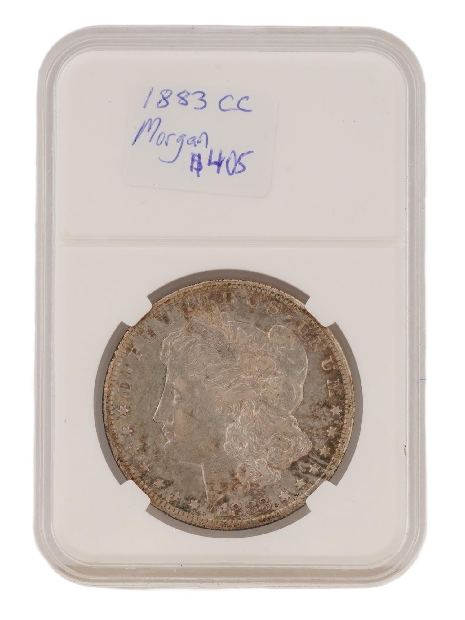 1883 AMERICAN CARSON CITY MORGAN SILVER DOLLAR COIN: An 1883 Carson City Morgan Silver Dollar coin, a popular issue from the historic Nevada mint. Struck in 90% silver and 10% copper. Features Lady Liberty on the obverse, wearing a Phrygian cap inscribe