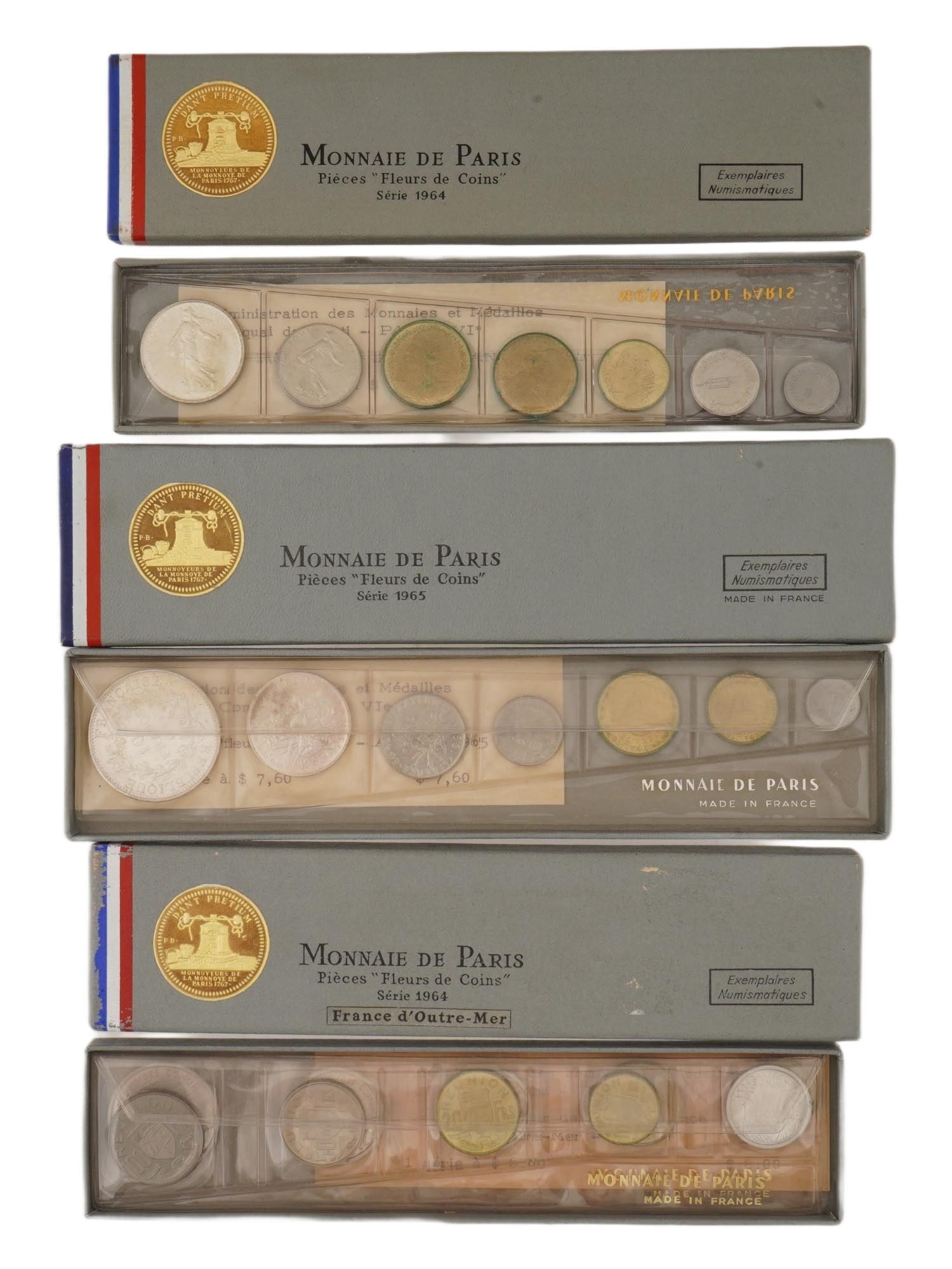 COLLECTION OF FRENCH 1964 1965 FLEURS DE COINS SETS: A collection of 1964 and 1965 Fleurs de Coins FDC sets of the Paris Mint. The lot includes the 1964 set for the French Overseas Territories France d Outre Mer. Each 1964 set French and Overseas contai