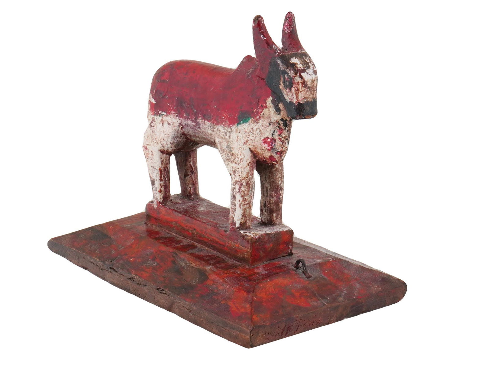 19TH C INDIAN NANDI PAINTED TEAK WOOD BULL FIGURE: A 19th century Indian Nandi bull figurine, made of carved teak wood. The bull is painted in red and white with a black face and stands on a layered wooden base. Collectible Indian Wood, Oriental Desk