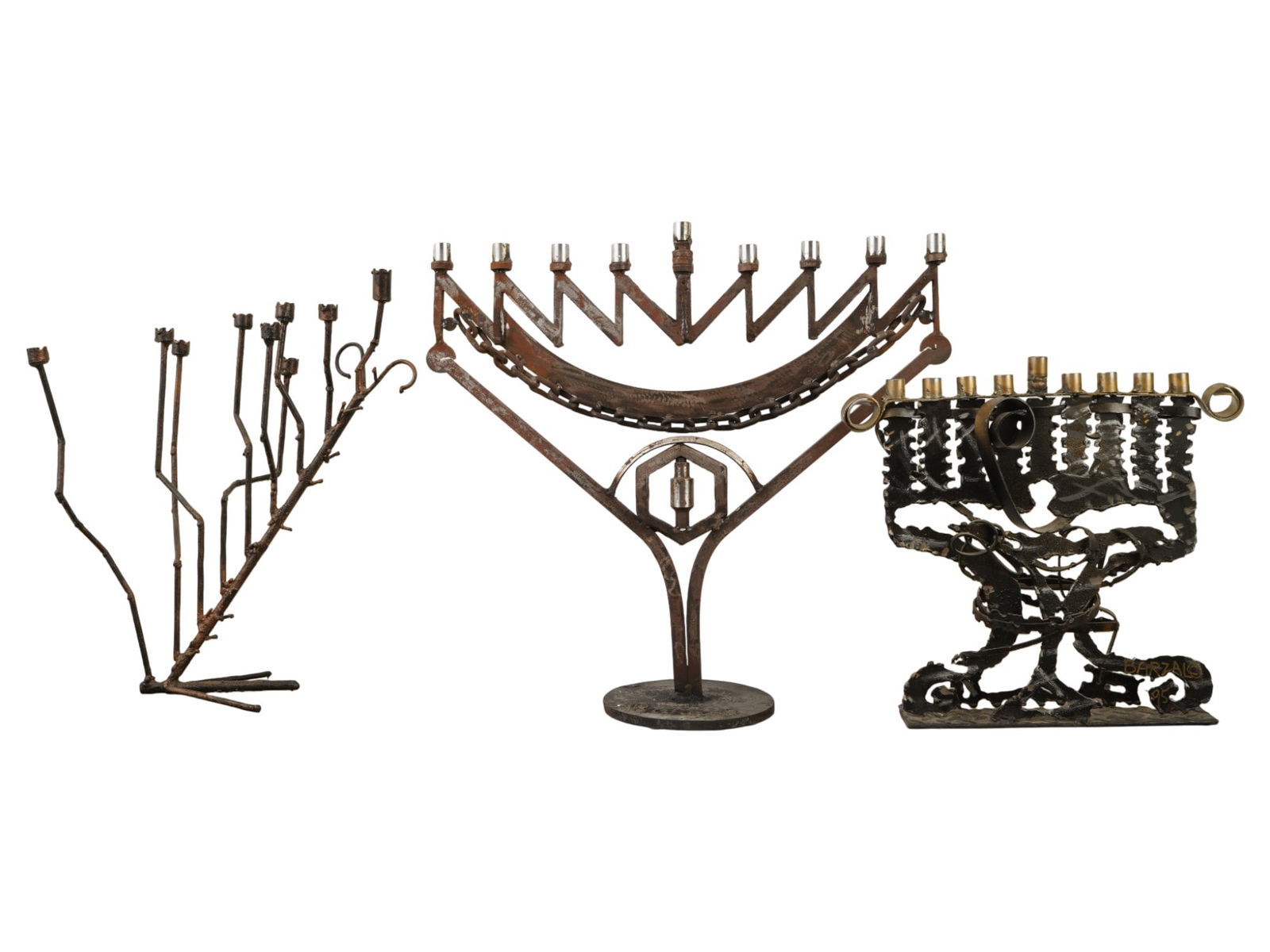 GROUP OF THREE LARGE VINTAGE JUDAICA METAL MENORAHS: A group of three large, vintage Judaica metal menorahs, likely used for Hanukkah, made in the Brutalist style of metal sculpture. These pieces are hand-forged or welded from raw iron or brass, known