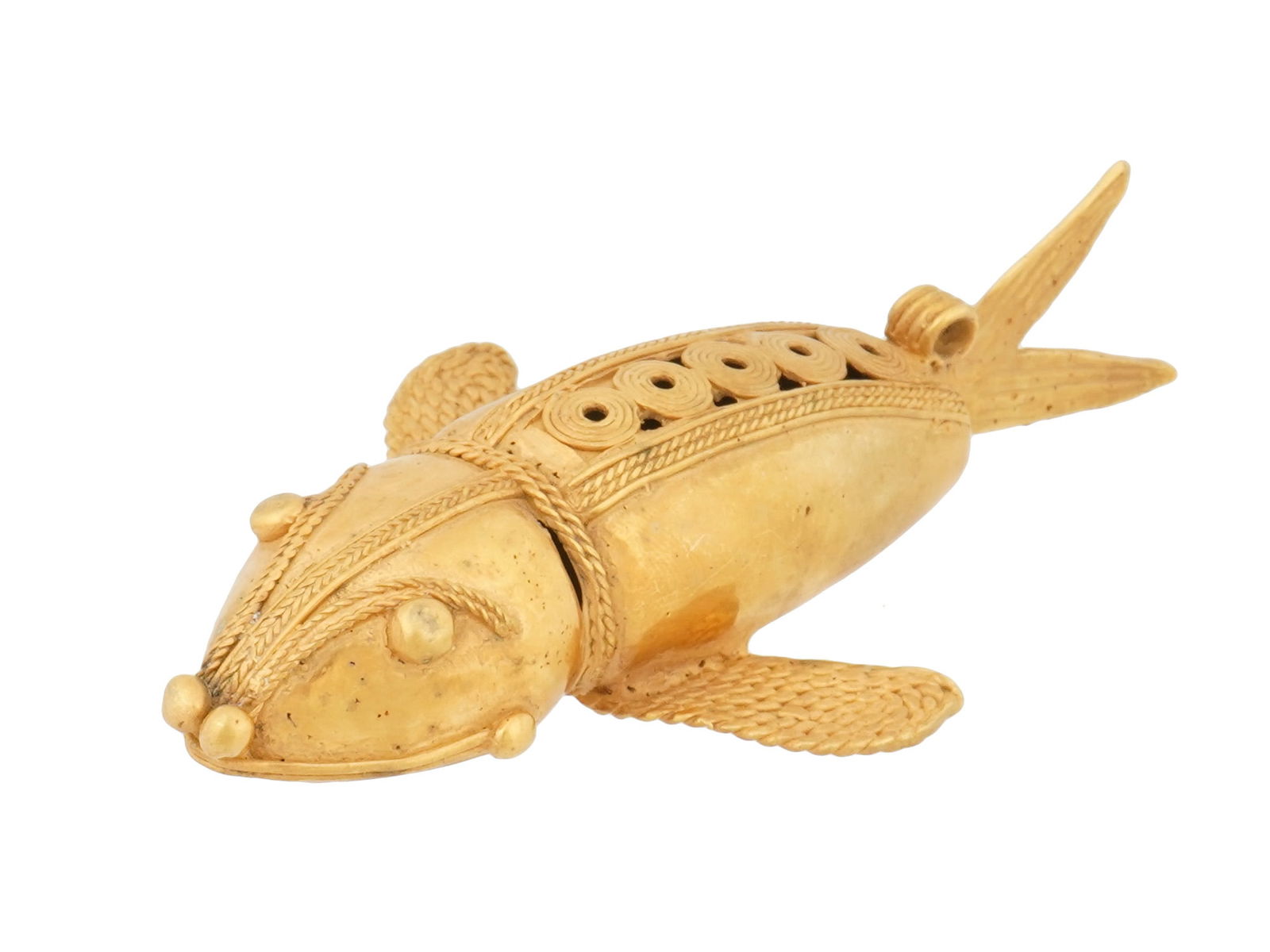 PRE COLUMBIAN TAIRONA TUMBAGA STYLE FISH FIGURINE: A figurine of a mythological flying fish. In the style of ancient Pre Columbian Tairona tumbaga artworks. Tumbaga, an alloy of gold and copper, showcases the metallurgical proficiency of Pre Columbian