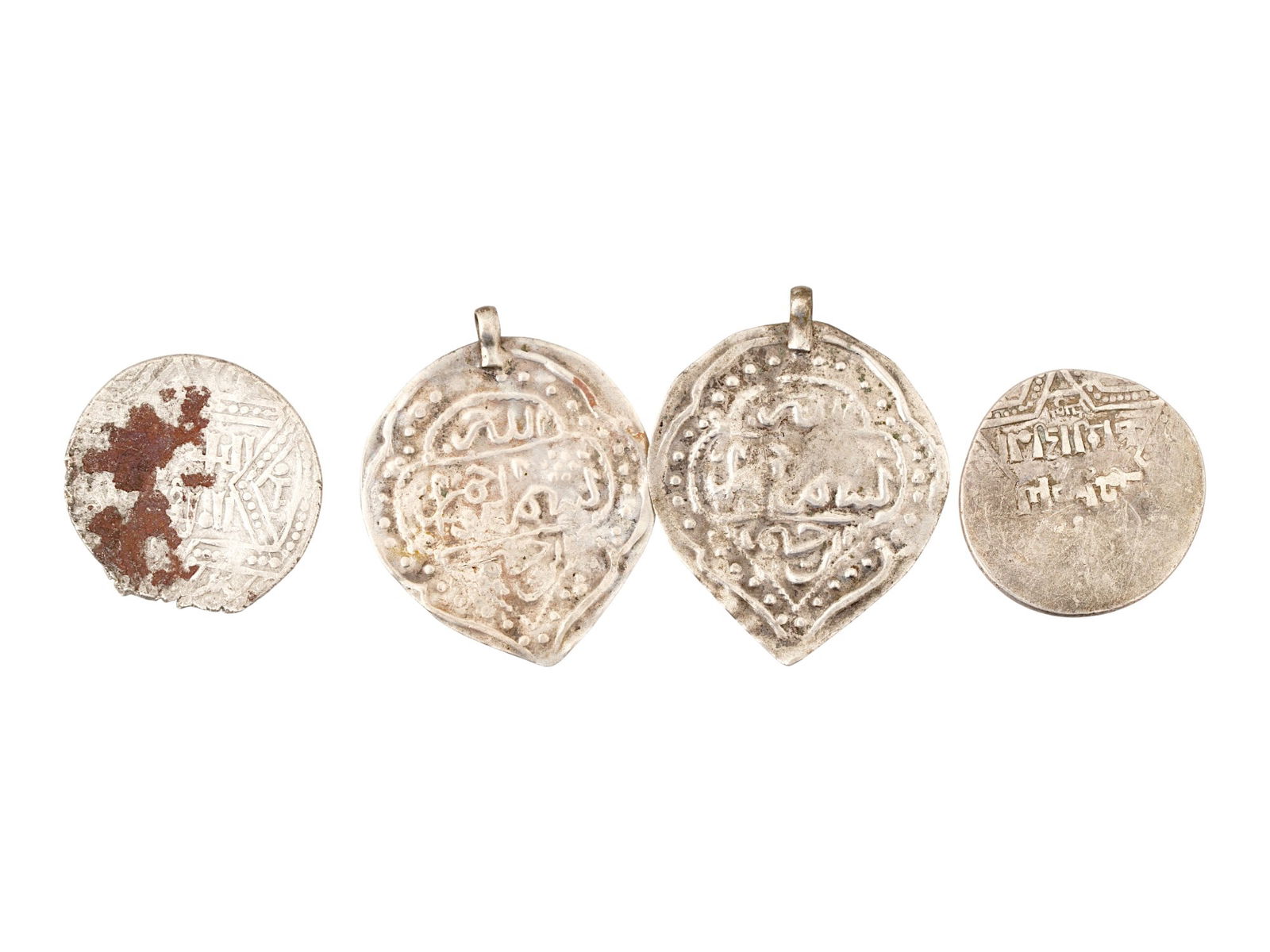 FOUR ANCIENT ISLAMIC SILVER COINS AND PENDANTS (1 of 2)
