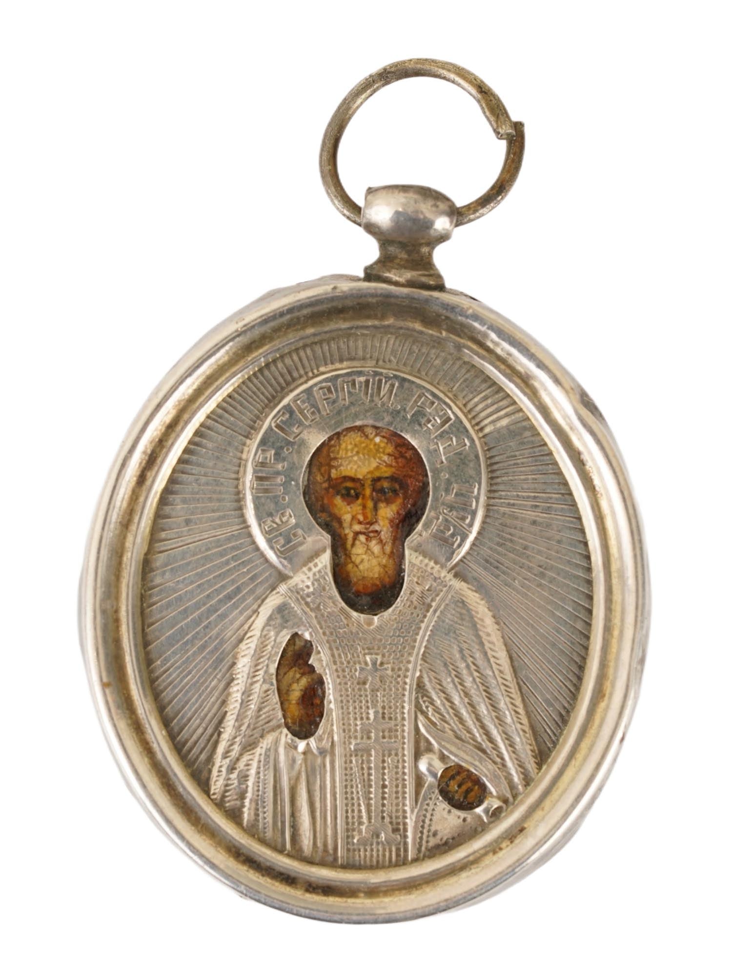 ANTIQUE 19TH C RUSSIAN RADONEZH SILVER ICON PENDANT: An antique 19th-century Russian traveling icon pendant depicts Saint Sergius of Radonezh, a highly revered miracle-working monk and spiritual leader in the Russian Orthodox Church. The piece has a sil