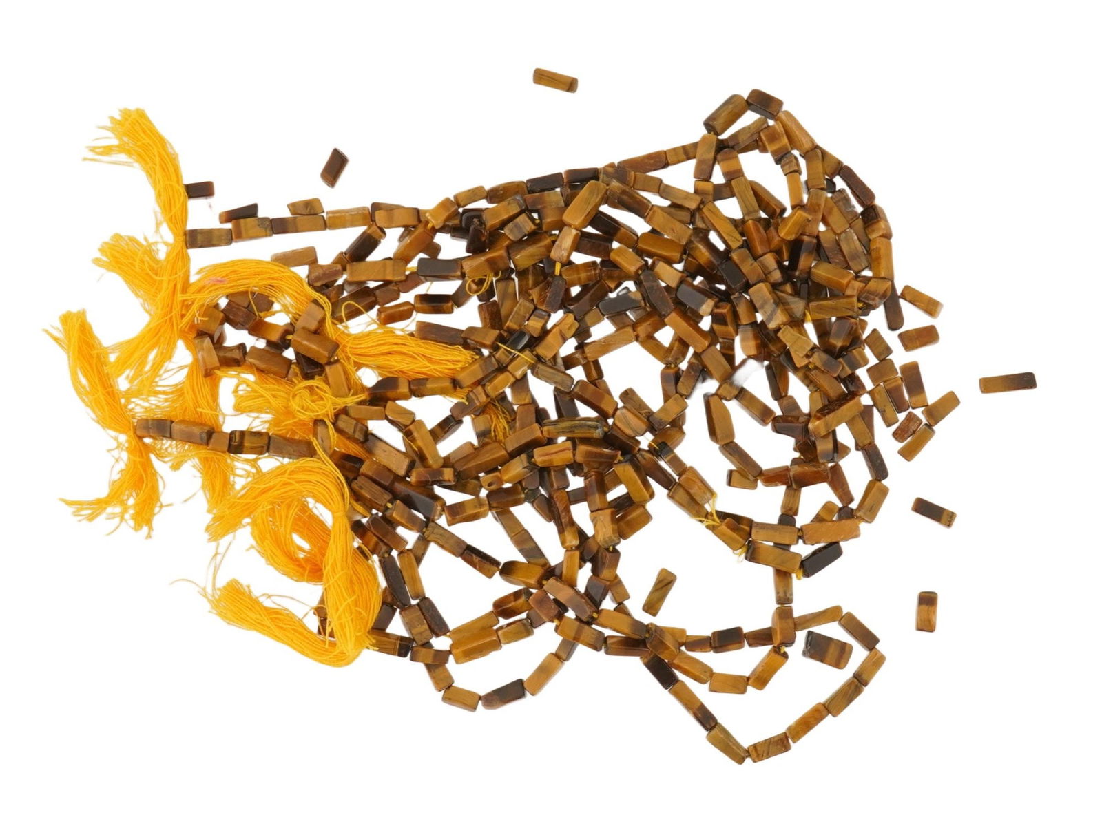 LOT OF NINE TIGERS EYE STONE BEAD STRANDS FOR JEWELRY: A lot of nine strands of tigers eye stone beads ready for use in jewelry making. The beads are carved into a rectangular tube with a smooth, polished finish. Natural Stone Beads, Jewelry Wares, and Ac