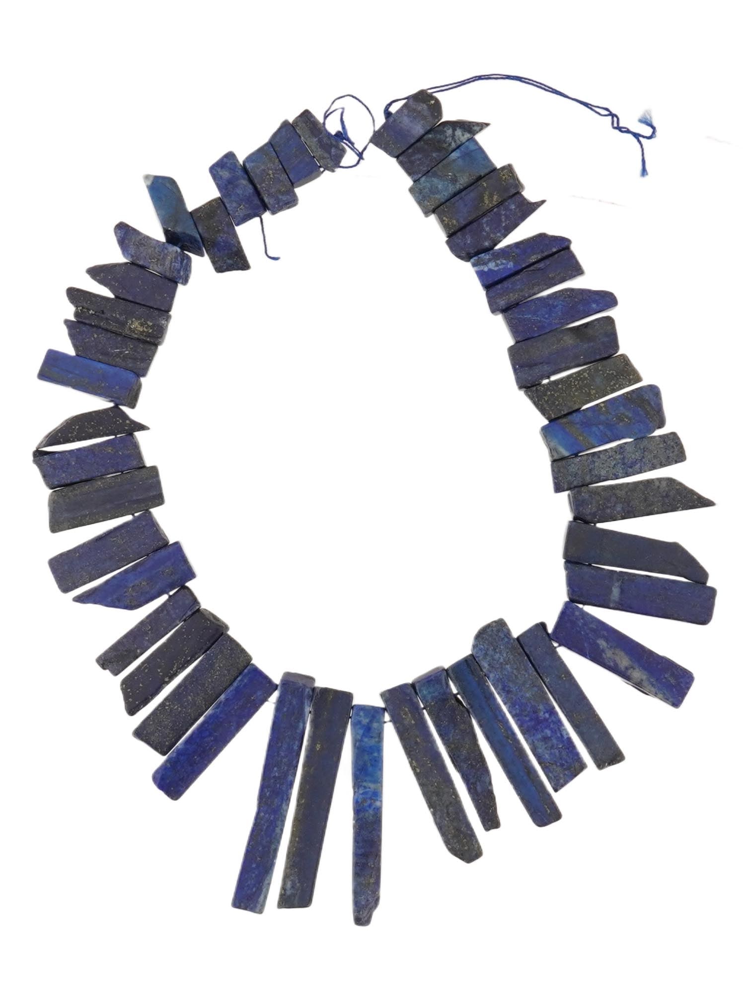 VINTAGE HANDCRAFTED LAPIS LAZULI BEADED NECKLACE: A vintage handcrafted lapis lazuli stone beaded necklace. The necklace consists of large lapis lazuli beads of varying lengths and irregular shapes, strung together on a thread. Mineral Stone Jewelry
