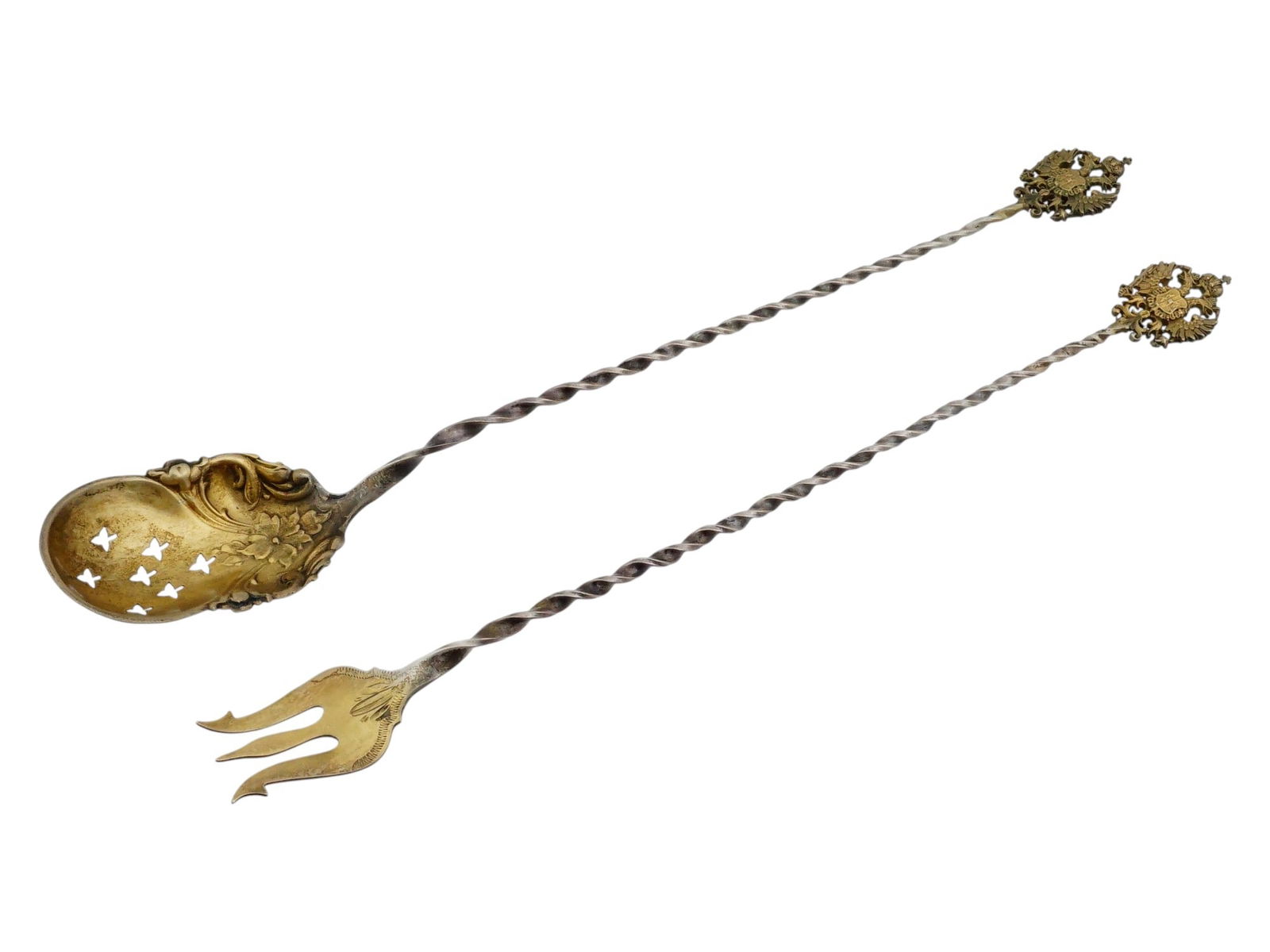 RUSSIAN SILVER SERVING PIECES PIERCED SPOON AND FORK: A pair of Russian silver serving pieces comprising a pierced spoon and matching three-tine fork. The spoon features a reticulated bowl, traditionally used for olives or hors doeuvres to allow excess