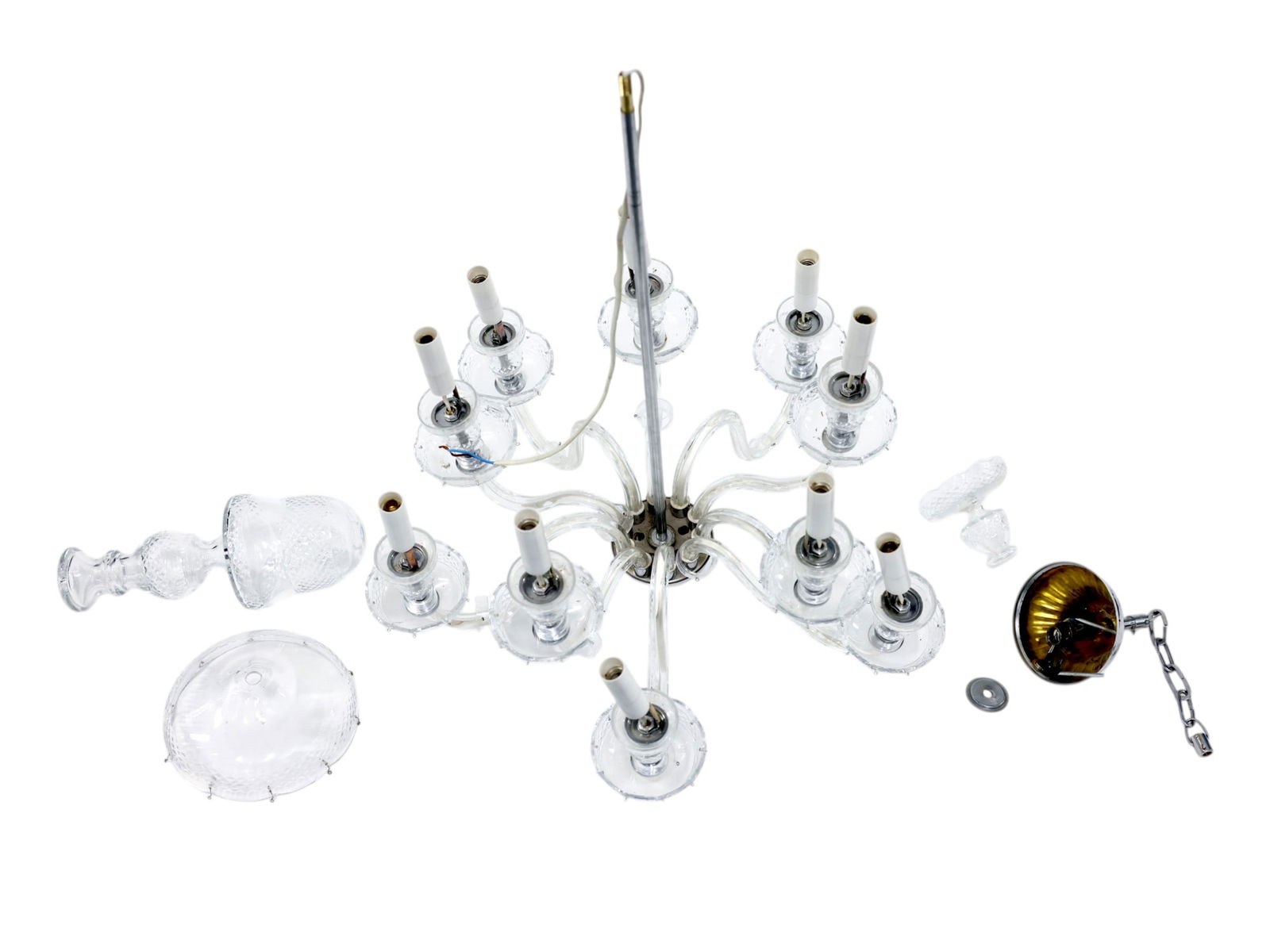 LIGHT GLASS ARM CHANDELIER BY VAUGHAN DESIGNS: A clear glass arm chandelier, which appears to be a multi-arm fixture by Vaughan Designs. The central column and body features a silver-toned metal stem that houses the main electrical wiring and