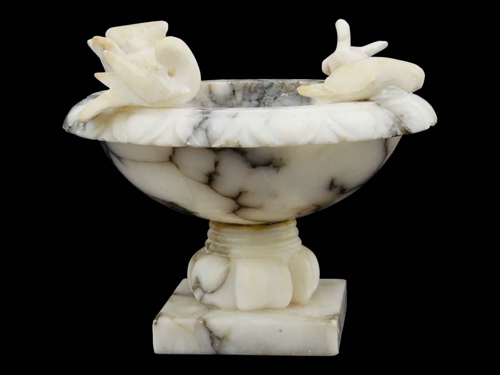 ITALIAN GRAND TOUR DOVES ALABASTER TAZZA BIRD BATH: An Italian Grand Tour alabaster tazza or bird bath, Doves of Pliny. The rim of the bowl is decorated with four removable dove figurines. The dove shaped decoration is considered a symbol of peace.