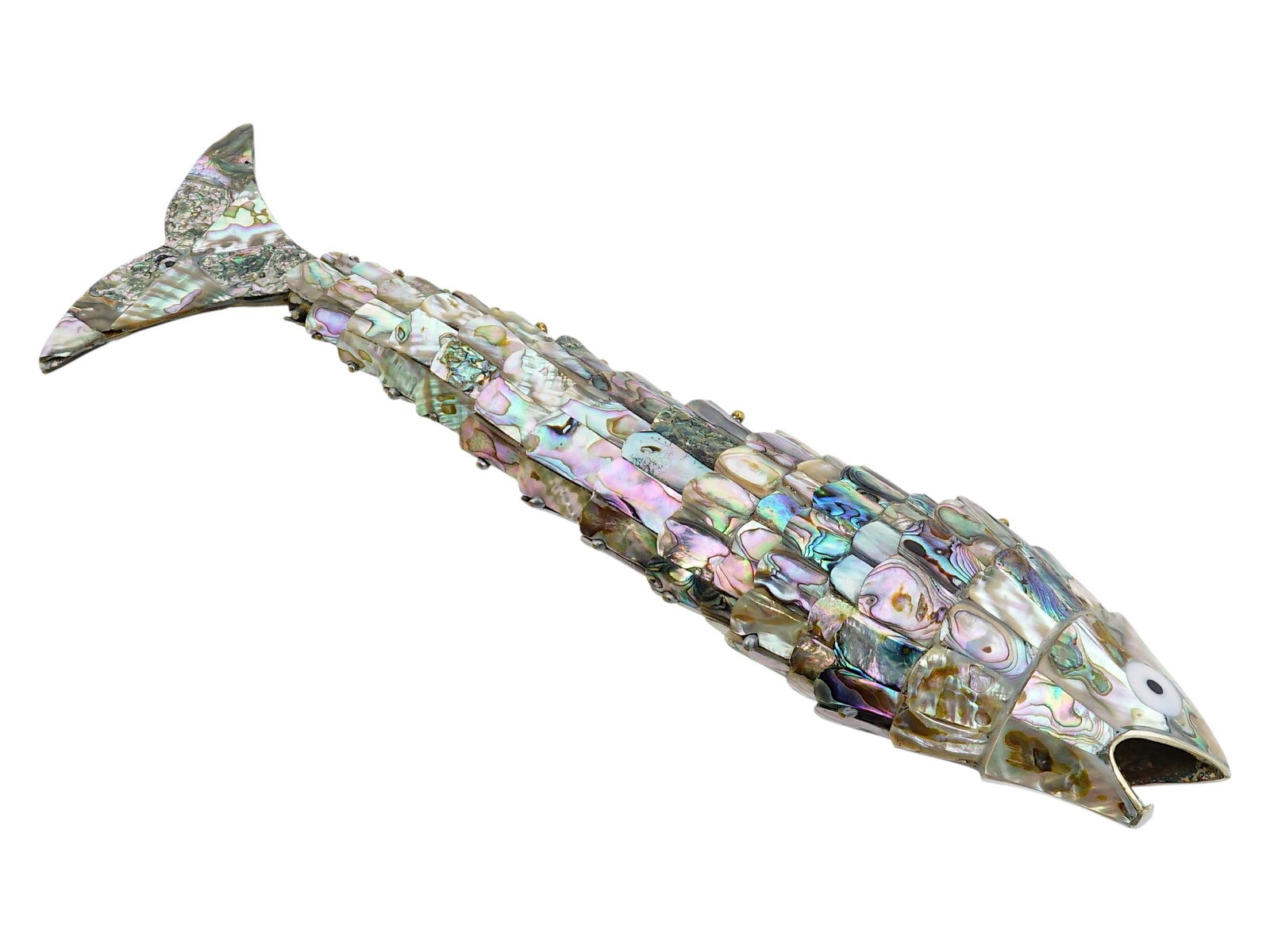 MOTHER OF PEARL ARTICULATED FISH SHAPED BOTTLE OPENER: A vintage articulated fish shaped bottle opener inlaid with mother of pearl or abalone shells. These decorative objects are often called moving fish due to their flexible body. The surface is
