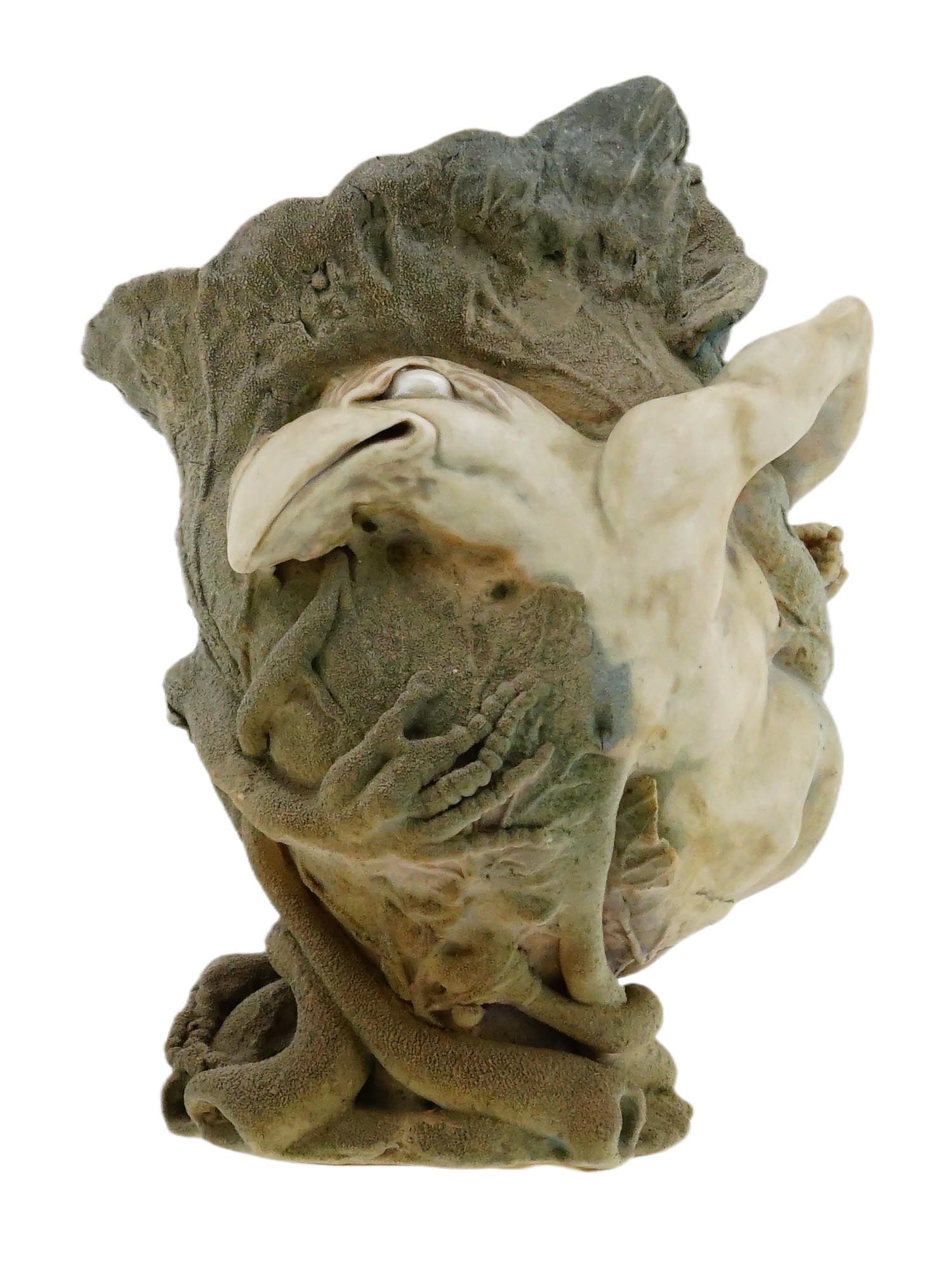 ANTIQUE GROTESQUE POTTERY VASE AFTER MARTIN BROTHERS: An antique grotesque pottery vase, created after the celebrated designs of the Martin Brothers. Formed as a textured cabbage. Emerging from the leafy body is an applied figure that combines a birds